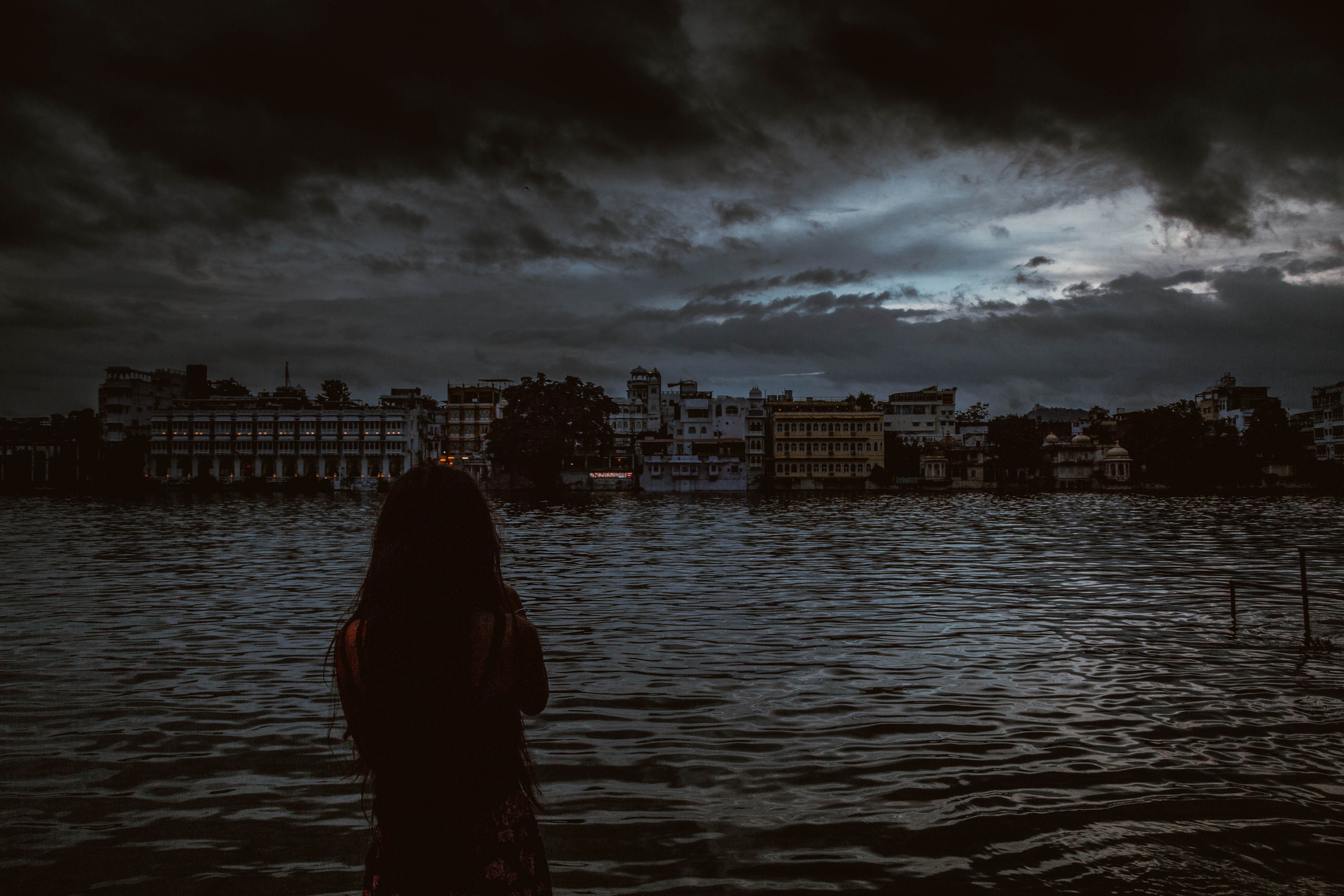cityscape, looking at view, 5K, building exterior, standing, city, lake, water, sky, cloud - sky, one person, real people, river, women, architecture, HD Wallpaper