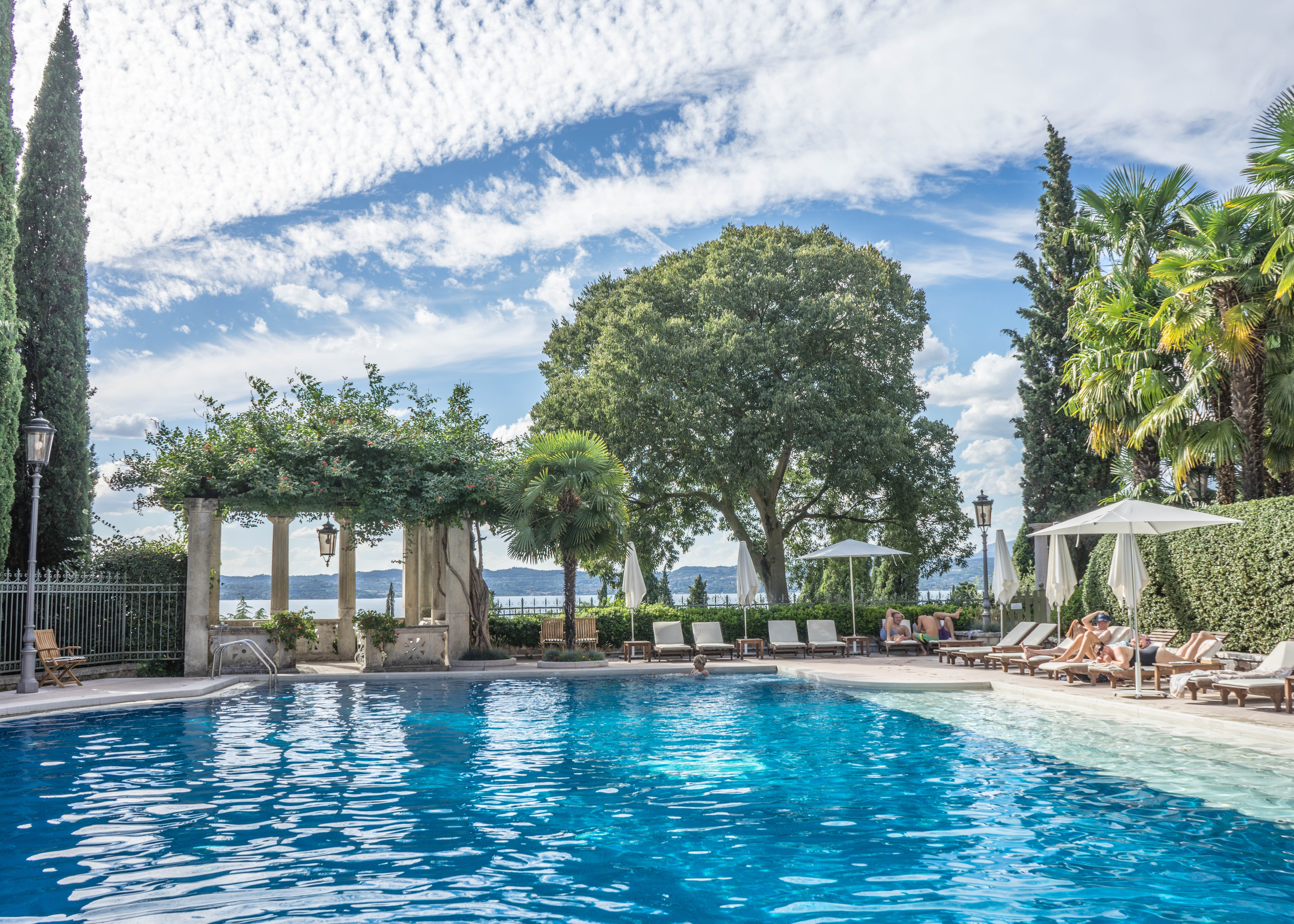 growth, pool, travel destinations, waterfront, outdoors, tourist resort, cloud - sky, tourism, lake garda, water, nature, sirmione, tree, 5K, luxury, villa cortine palace, HD Wallpaper