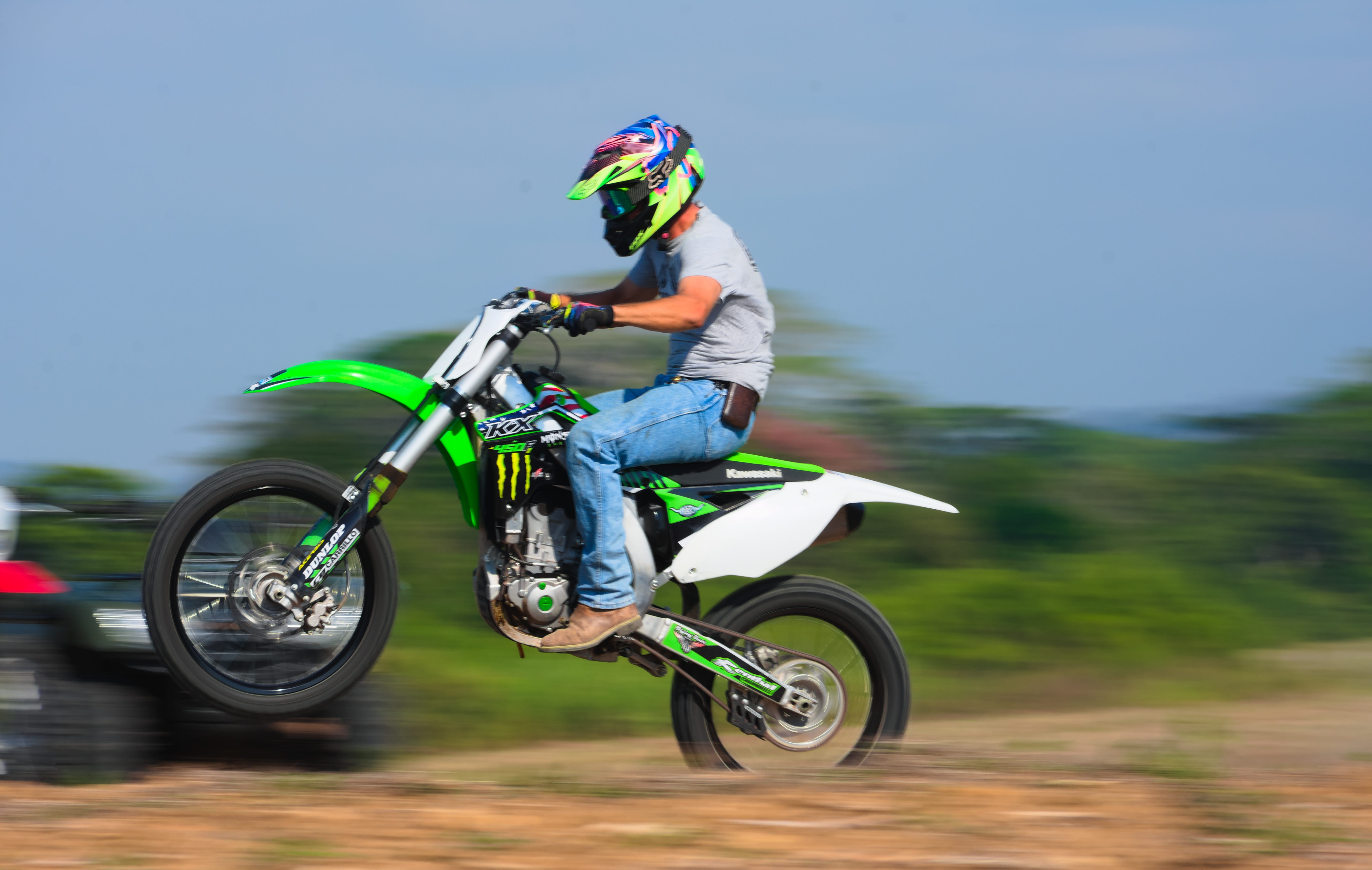 headwear, full length, kawasaki, day, lifestyles, helmet, sports helmet, blurred motion, outdoors, ride, crash helmet, recreation sport, offroad, motocross, HD Wallpaper