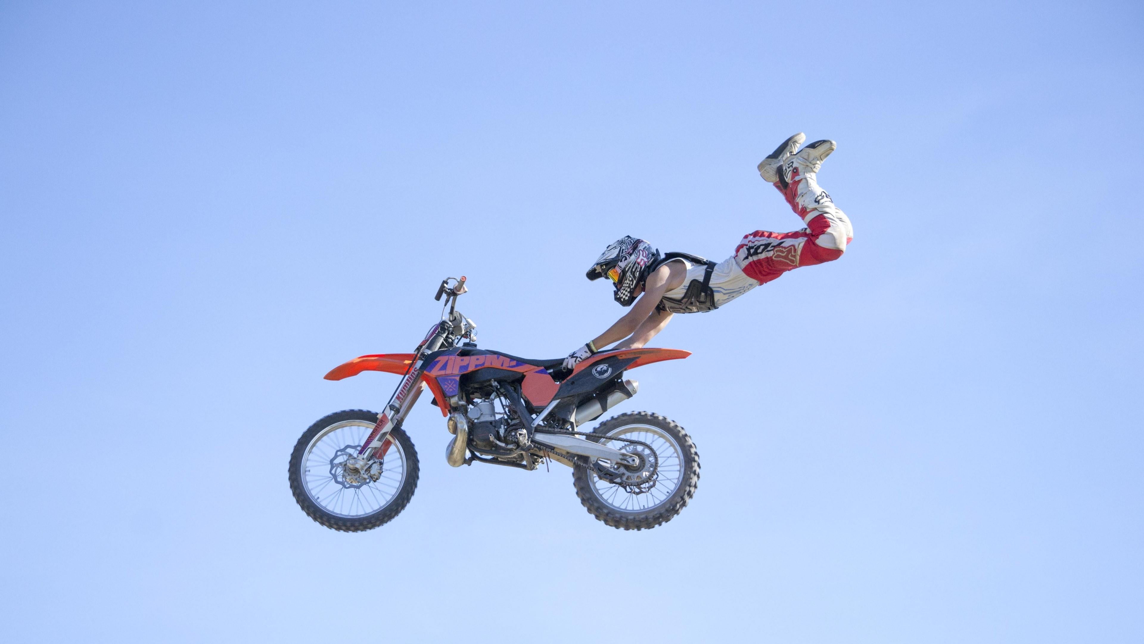 motocross, outdoors, motorcycle, helmet, stunt, riding, skill, extreme sports, clear sky, risk, freestyle, copy space, 4K, motion, mid-air, leisure activity, HD Wallpaper