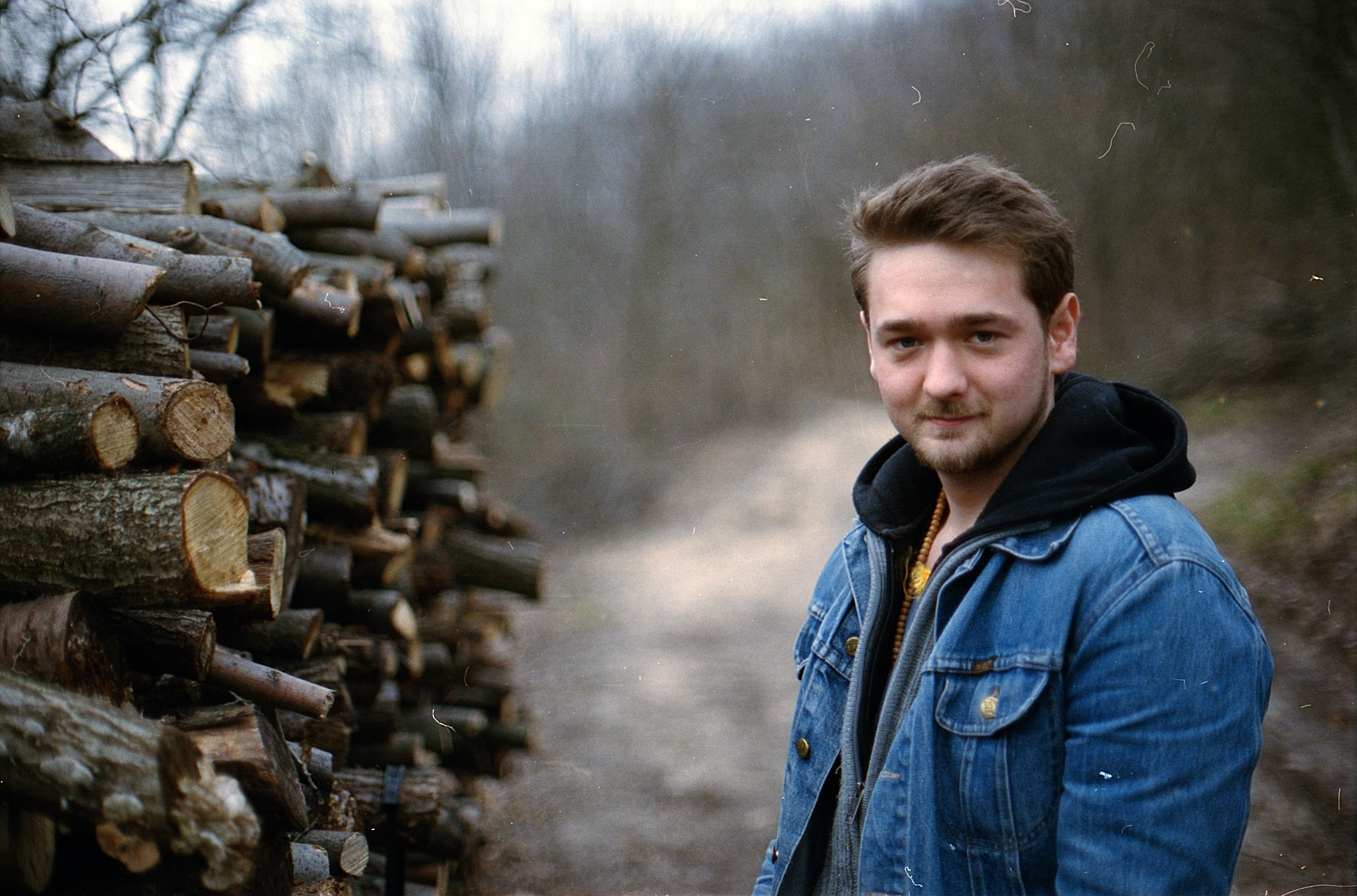 caucasian Ethnicity, young, man, real people, log, wood, lumber, hiking, nature, one Person, casual clothing, young adult, blue, 5K, wearing, logs, wood - Material, HD Wallpaper