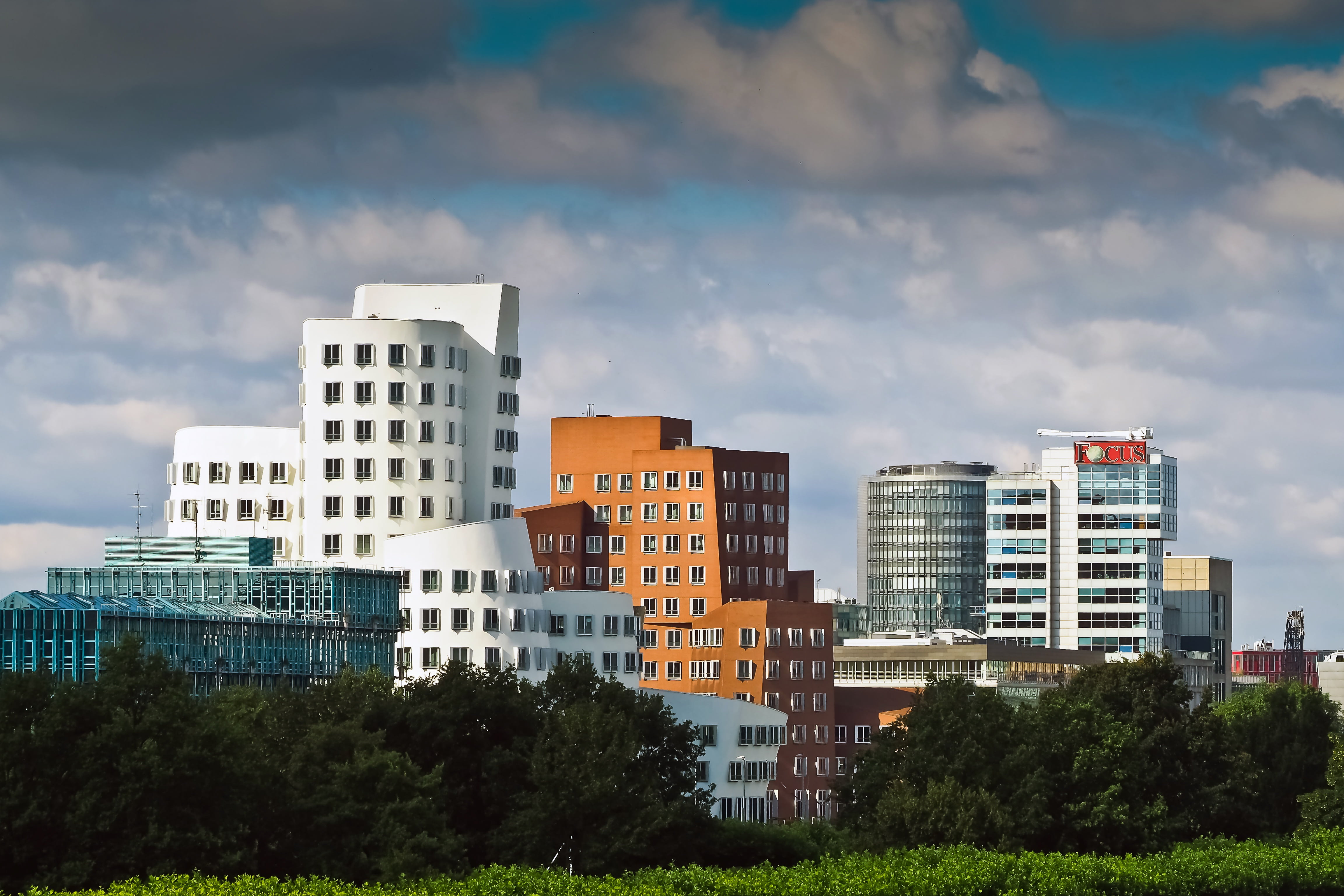 clouds, modern architecture, nature, plant, hauswand, built structure, office building exterior, growth, day, tree, glass, 4K, gehry buildings, covered sky, HD Wallpaper