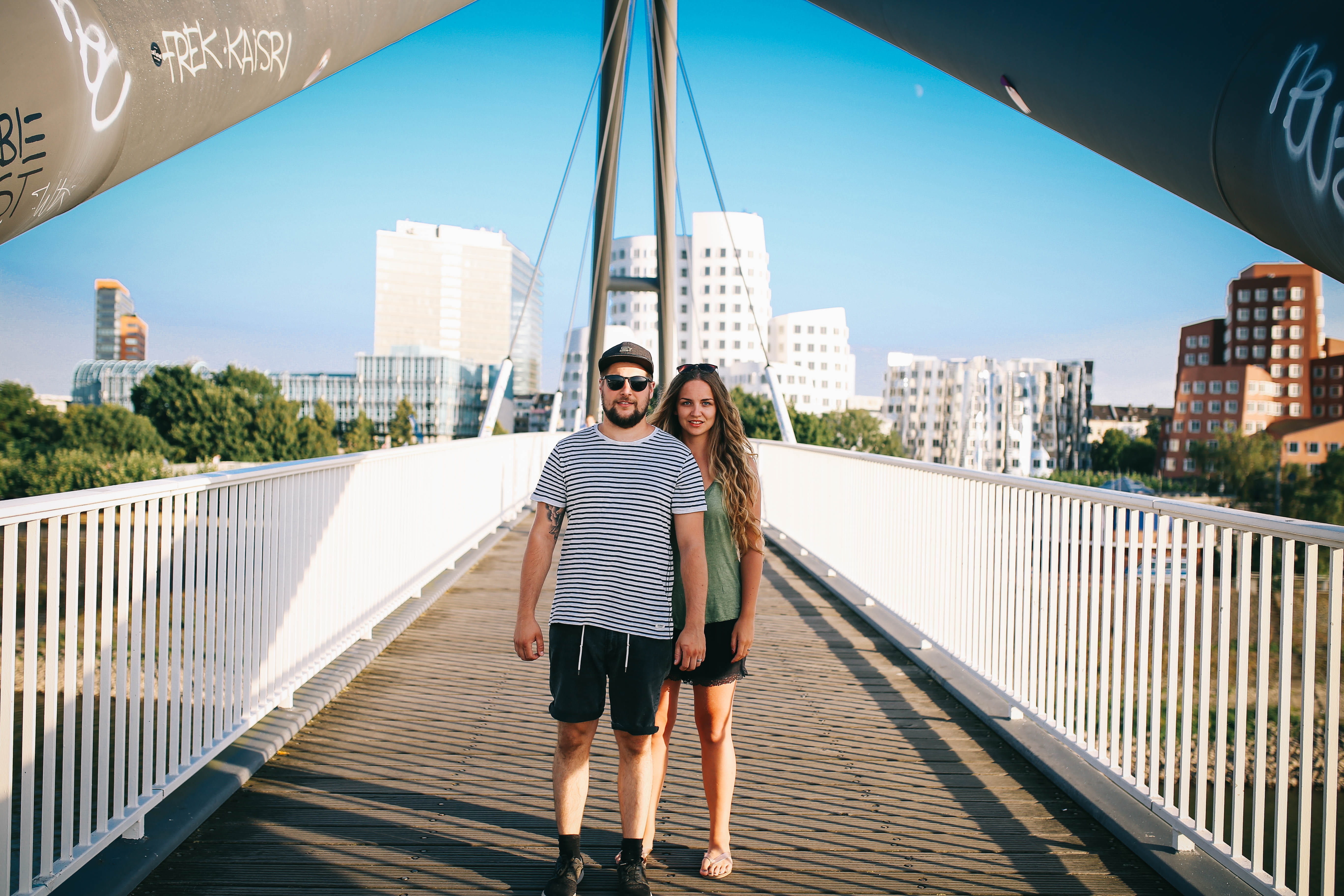valentine, sunny, two people, serious, couple - relationship, looking at camera, young women, architecture, young men, emotion, symmetry, front view, city, HD Wallpaper
