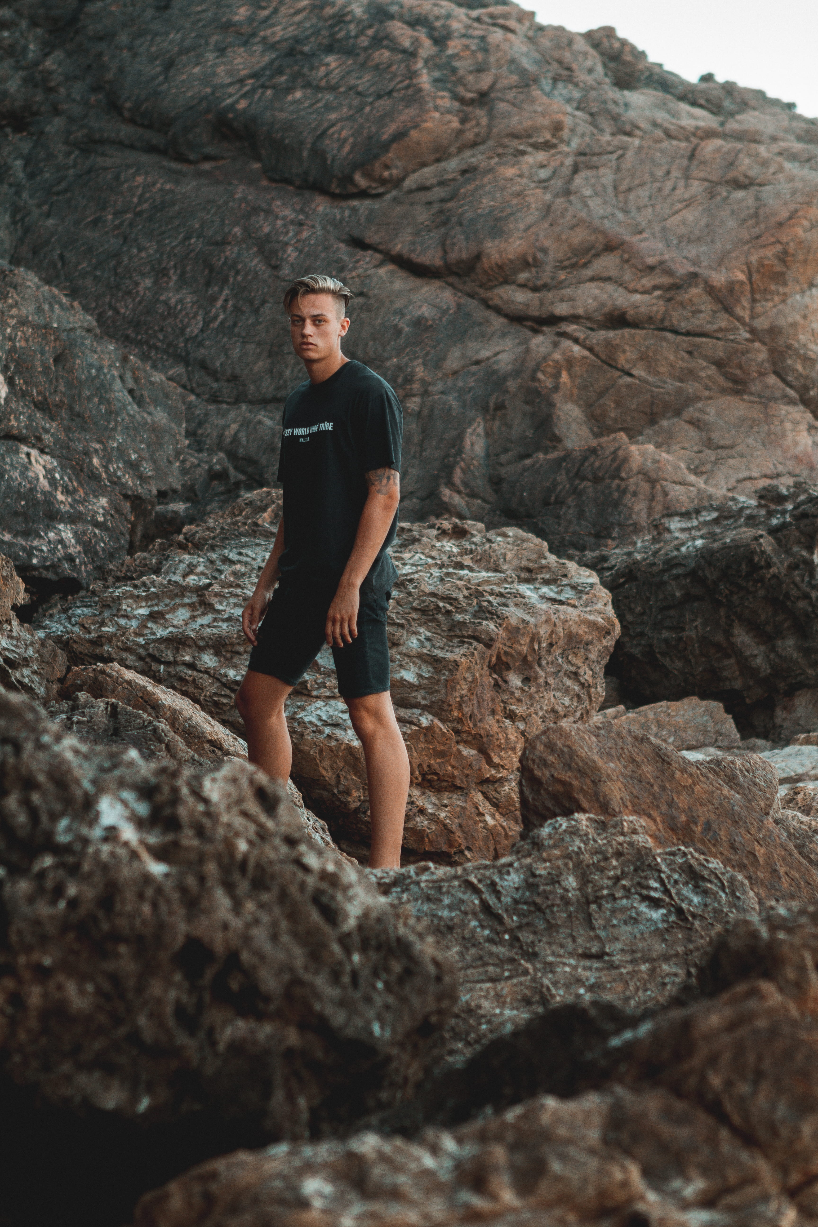 day, land, climbing, portrait, rock formation, male, women, young women, beach, lifestyles, one person, rocks, real people, solid, nature, standing, casual clothing, Phone HD Wallpaper