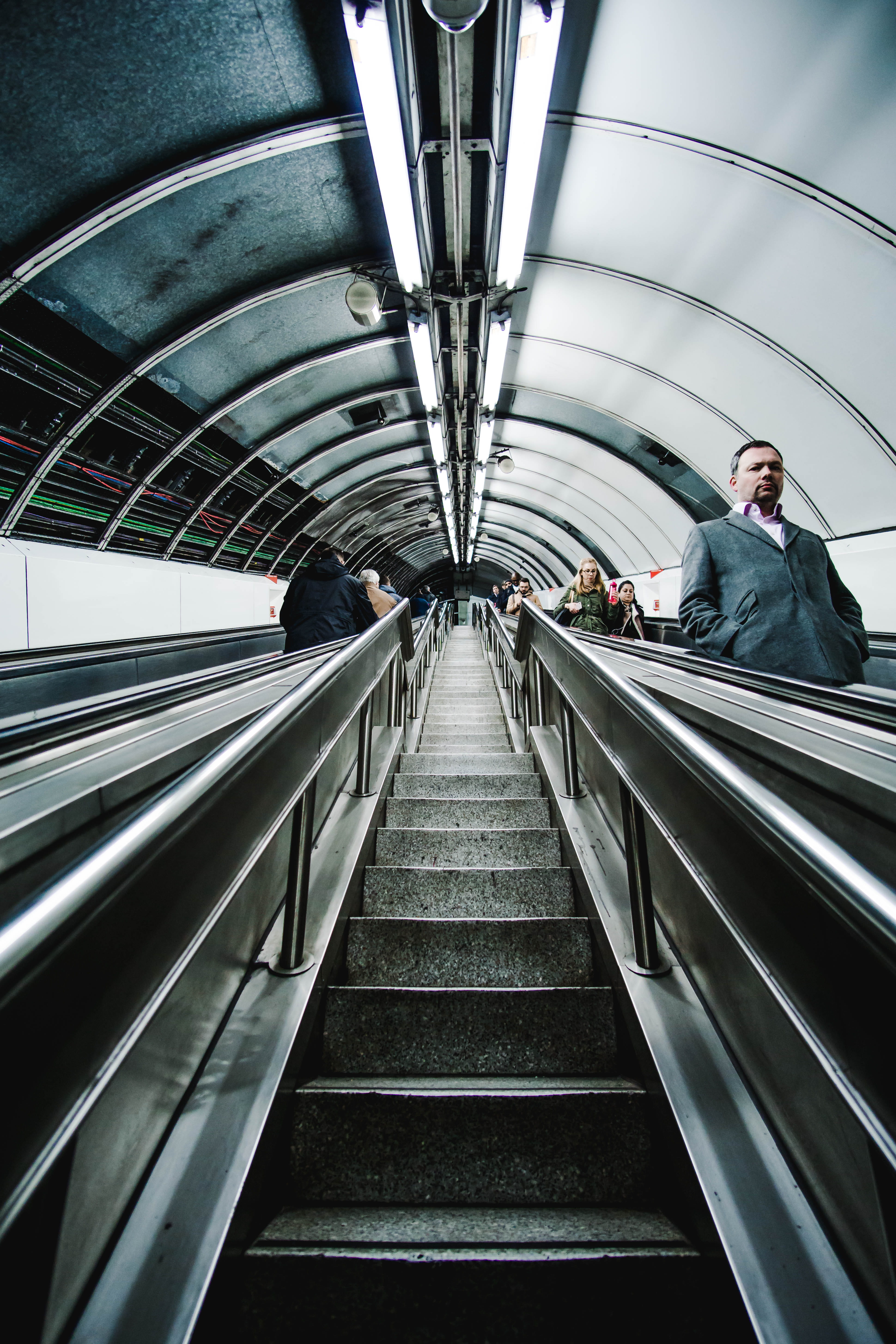 staircase, london, angle, arch, low, 5K, technology, symmetry, low angle shot, adult, subway system, direction, indoors, convenience, built structure, Phone HD Wallpaper