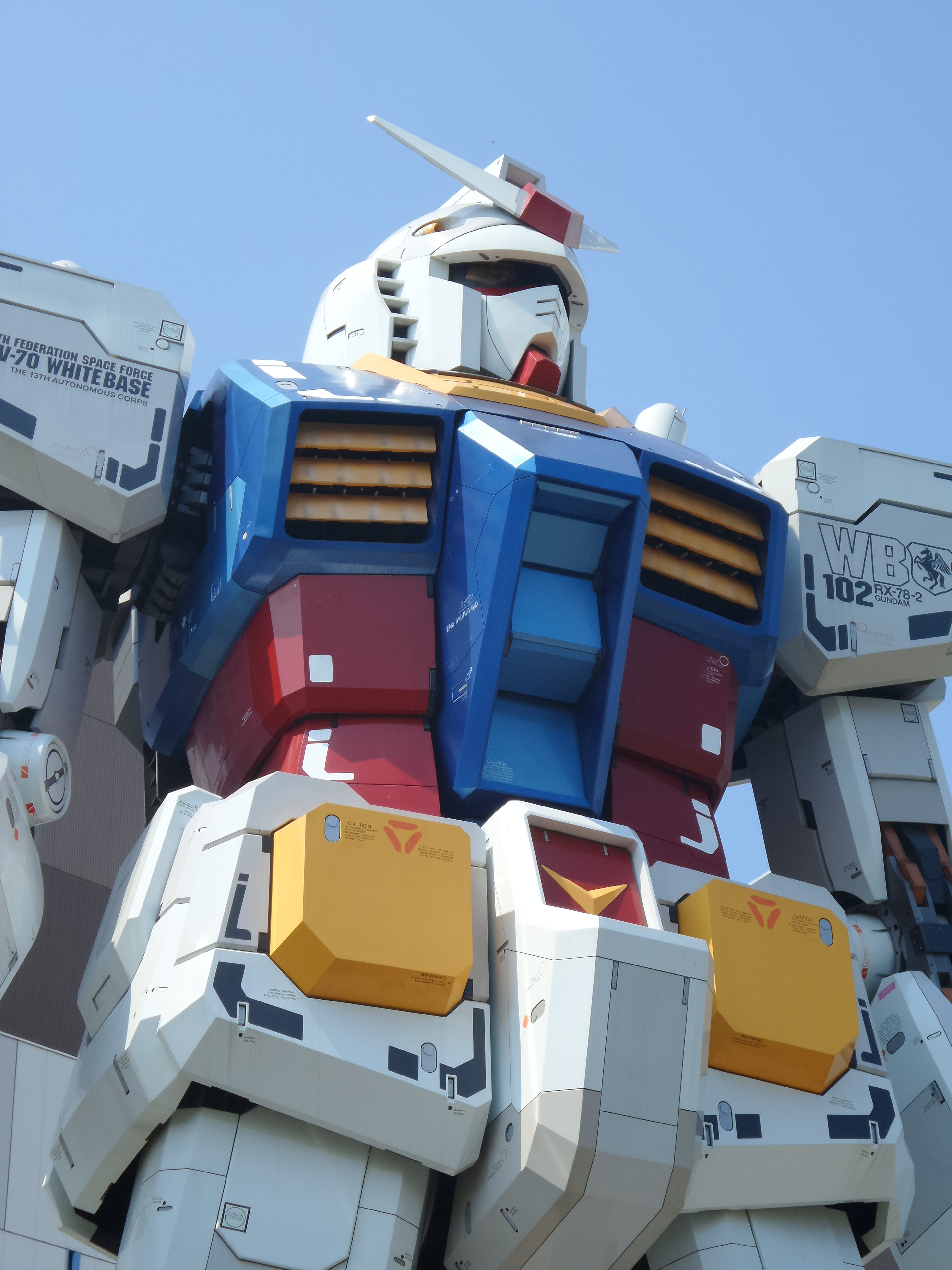 clear sky, Front, built structure, Robot, blue, transportation, 5K, outdoors, mode of transportation, Tokyo, sunlight, stack, no people, low angle view, Phone HD Wallpaper