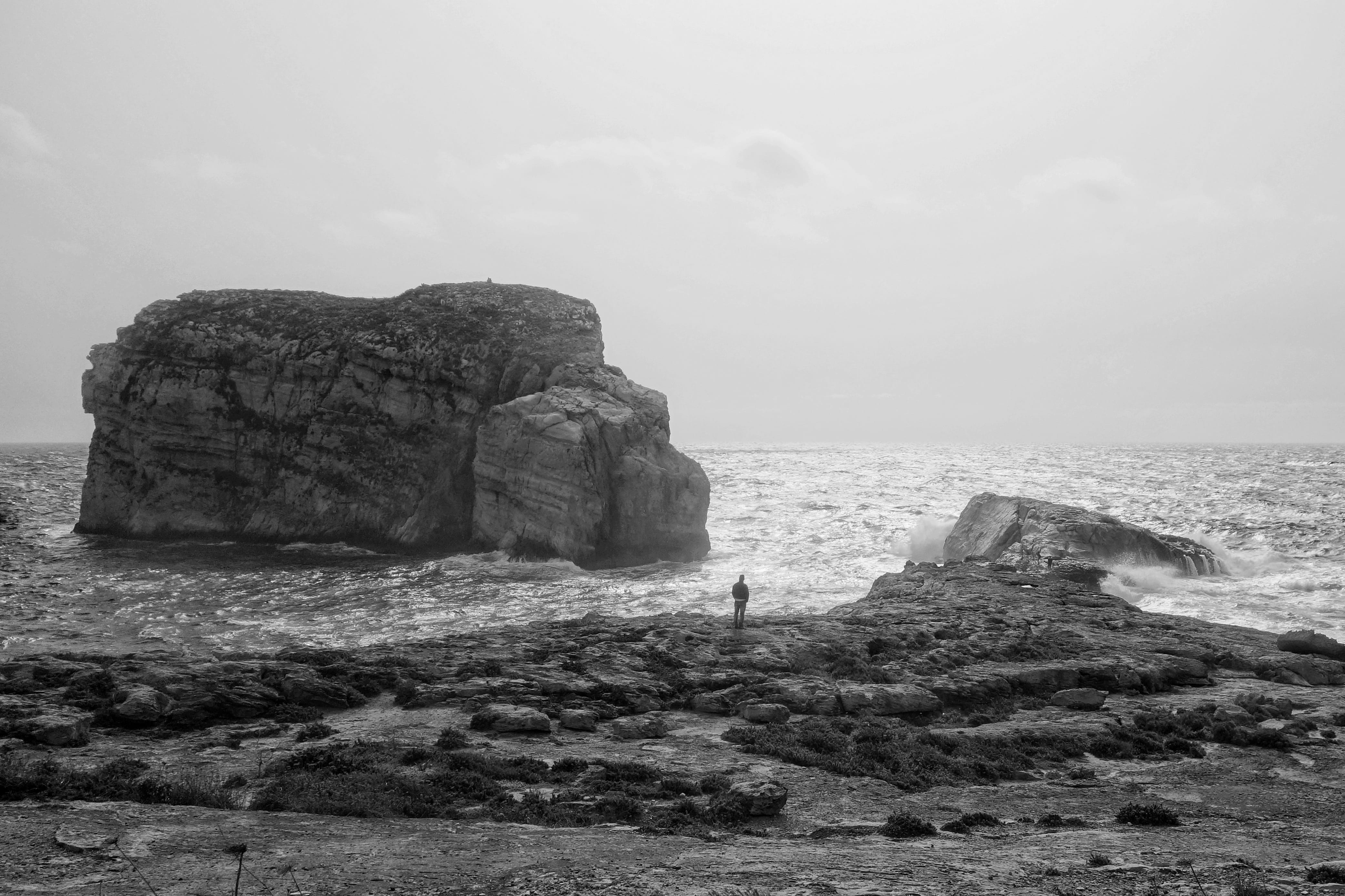 beauty in nature, waves, tranquility, peace, outdoors, dwejra bay, water, travelling, rocks, bw, person, physical geography, scenics - nature, non-urban scene, HD Wallpaper