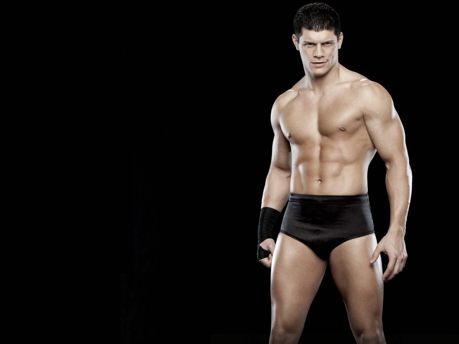 one person, studio shot, front view, athlete, lifestyles, black background, healthy lifestyle, standing, 720P, young adult, sport, human body part, wrestler, HD Wallpaper