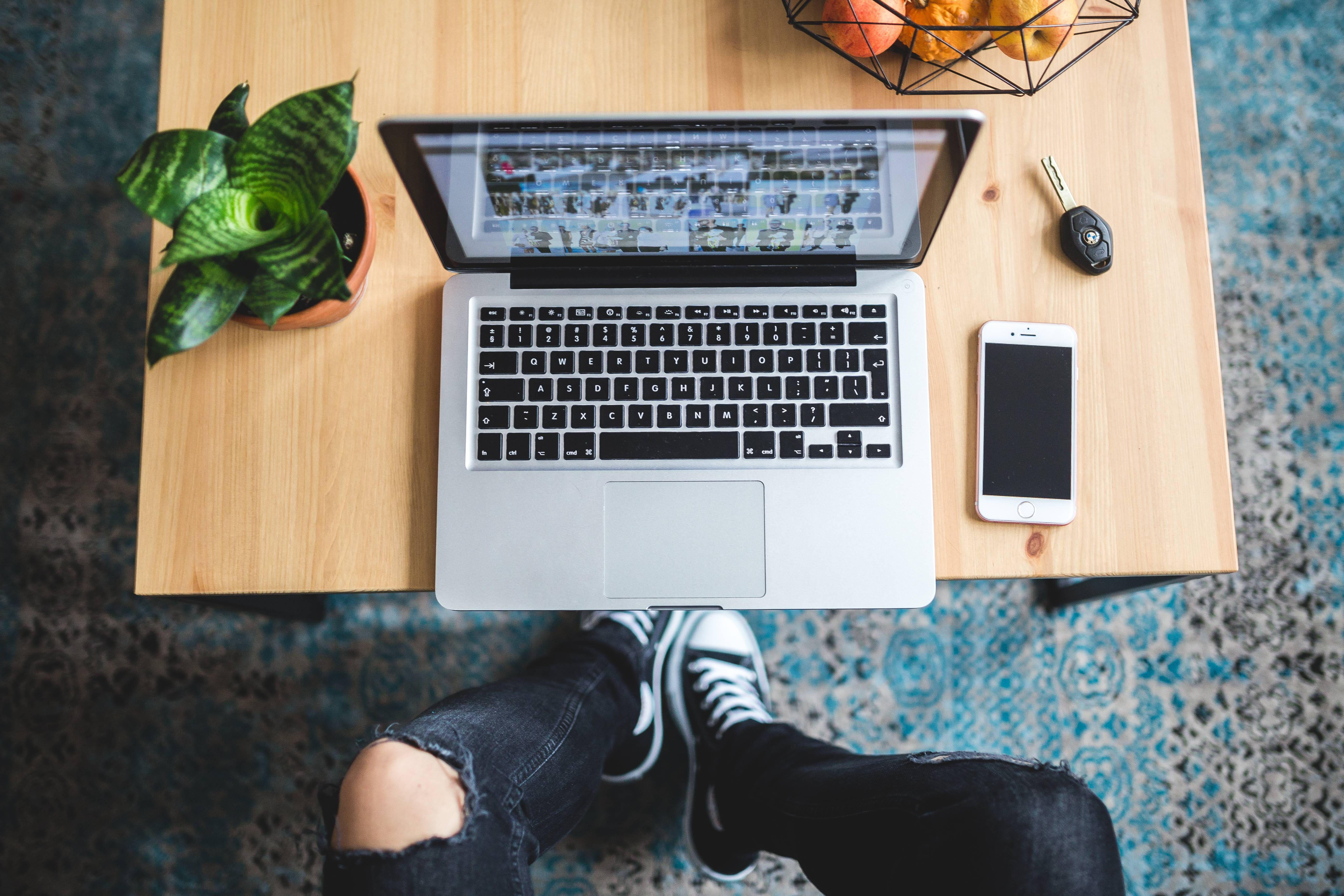 legs, one person, black, silver, human body part, Woman, all star, feet, smart phone, computer equipment, typing, sneakers, ripped, wooden table, wooden, HD Wallpaper