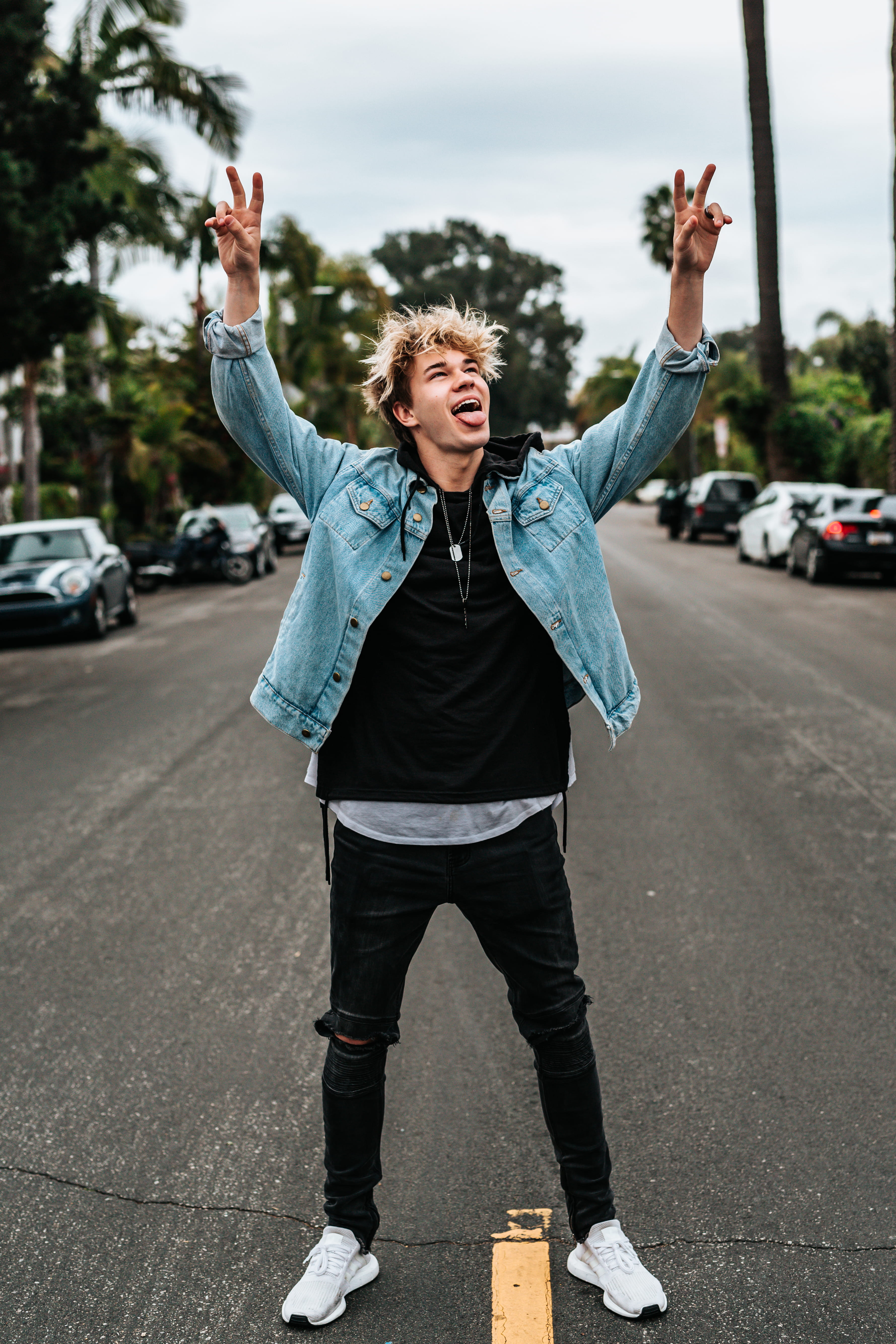 person, peace, denim jacket, arms raised, human arm, wearing, standing, black, motor vehicle, pants, city, real people, emotion, sign, lifestyles, raising, Phone HD Wallpaper