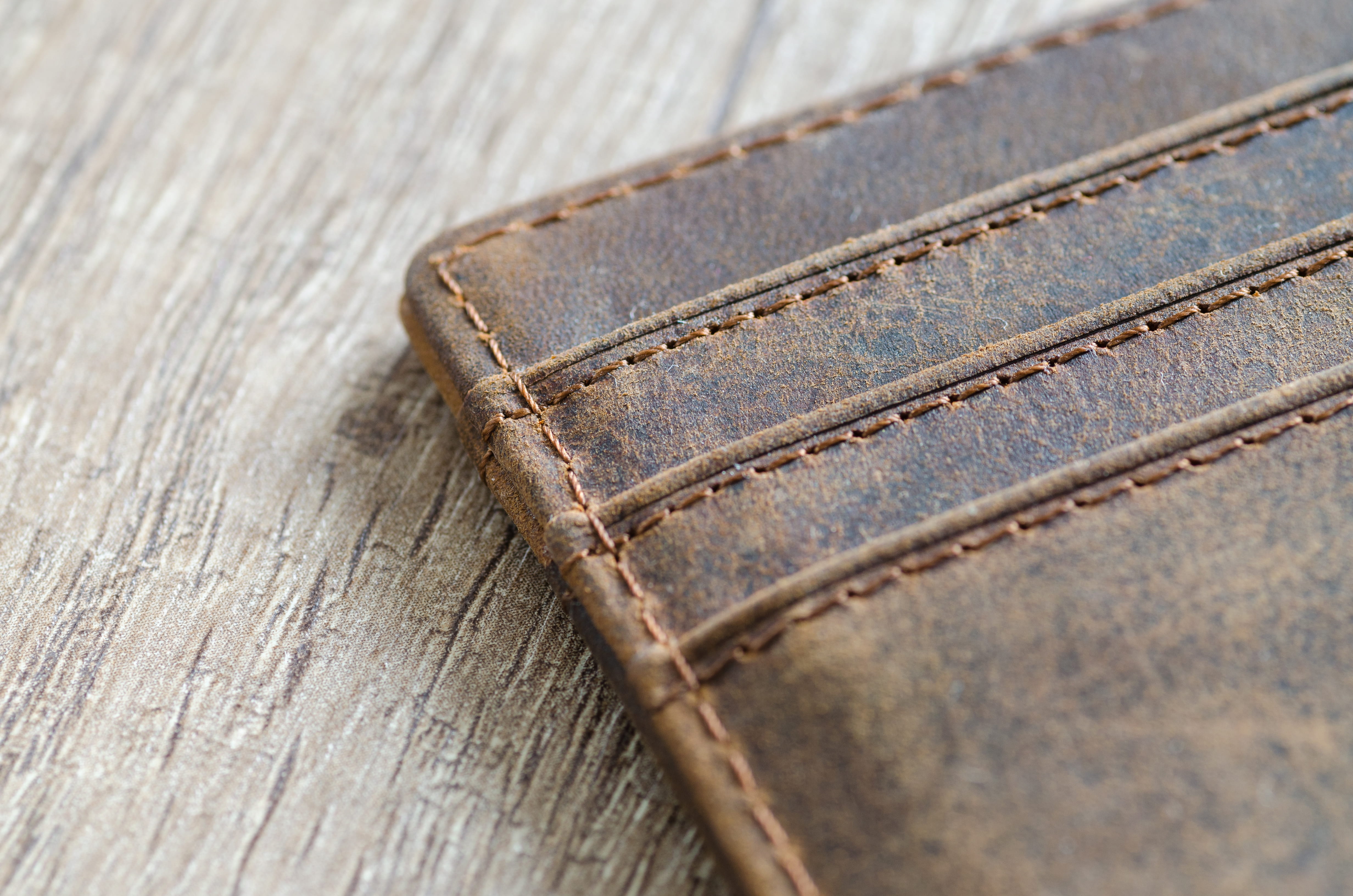 wood - material, brown, leather, 4K, sewing threads, casual clothing, care, wallet, clothing, extreme close-up, close-up, textile, jeans, textured, simplicity, HD Wallpaper