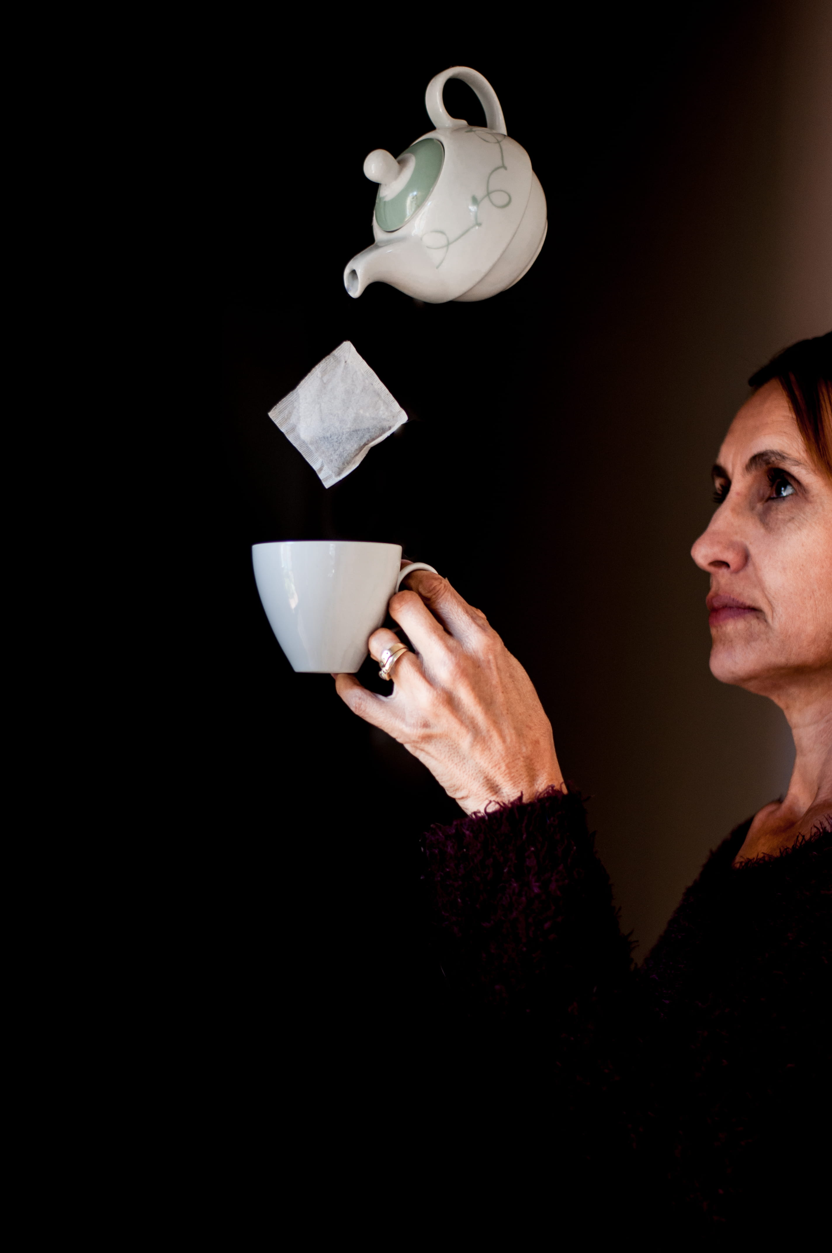 4K, tea, tea cup, concentration, copy space, teacup, refreshment, black background, holding, portrait, coffee, studio, one person, teapot, mug, magic, Phone HD Wallpaper