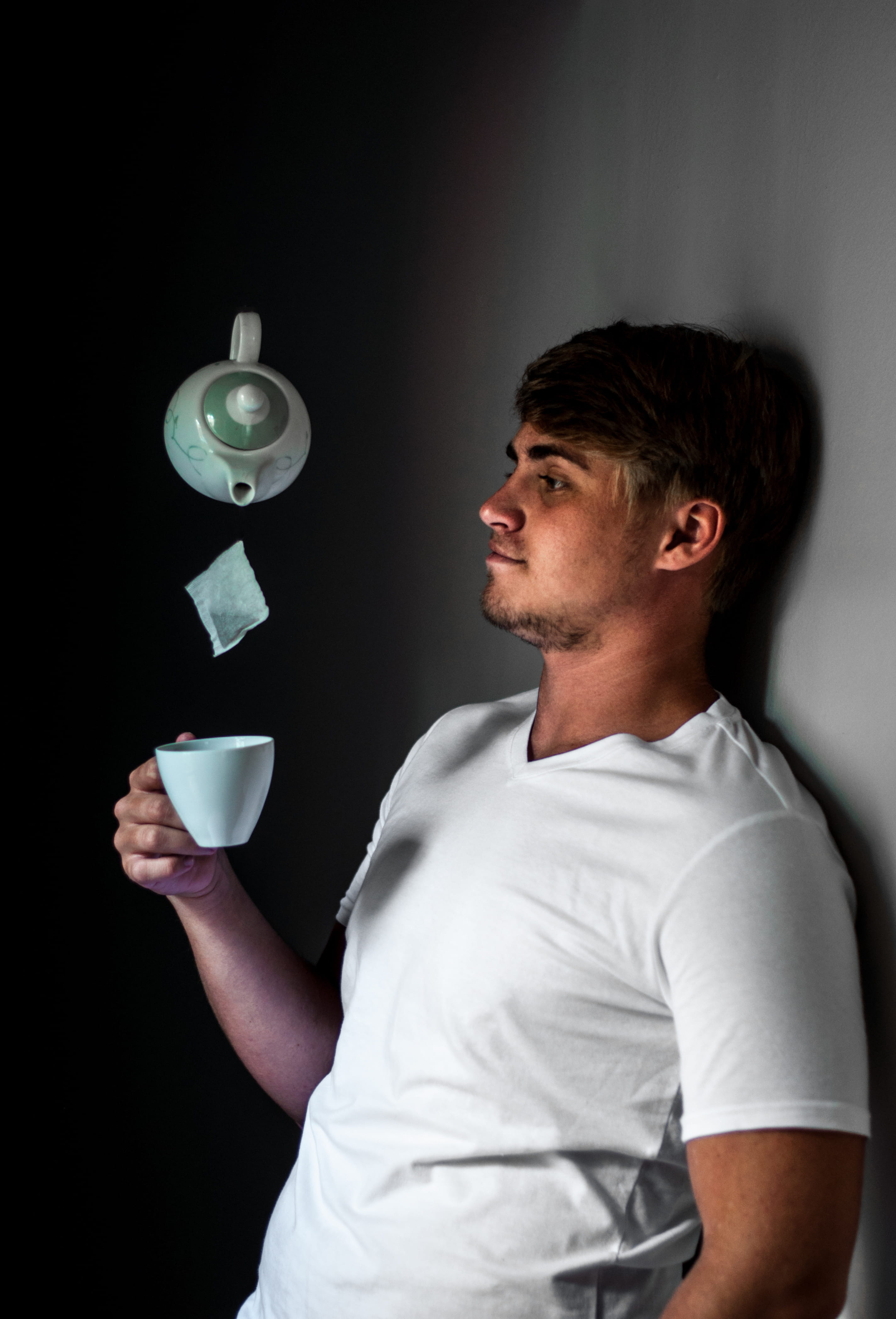 one person, facial expression, magic, lifestyles, tea cup, young adult, drink, young men, floating, white, actor, wear, man, trick, standing, refreshment, Phone HD Wallpaper