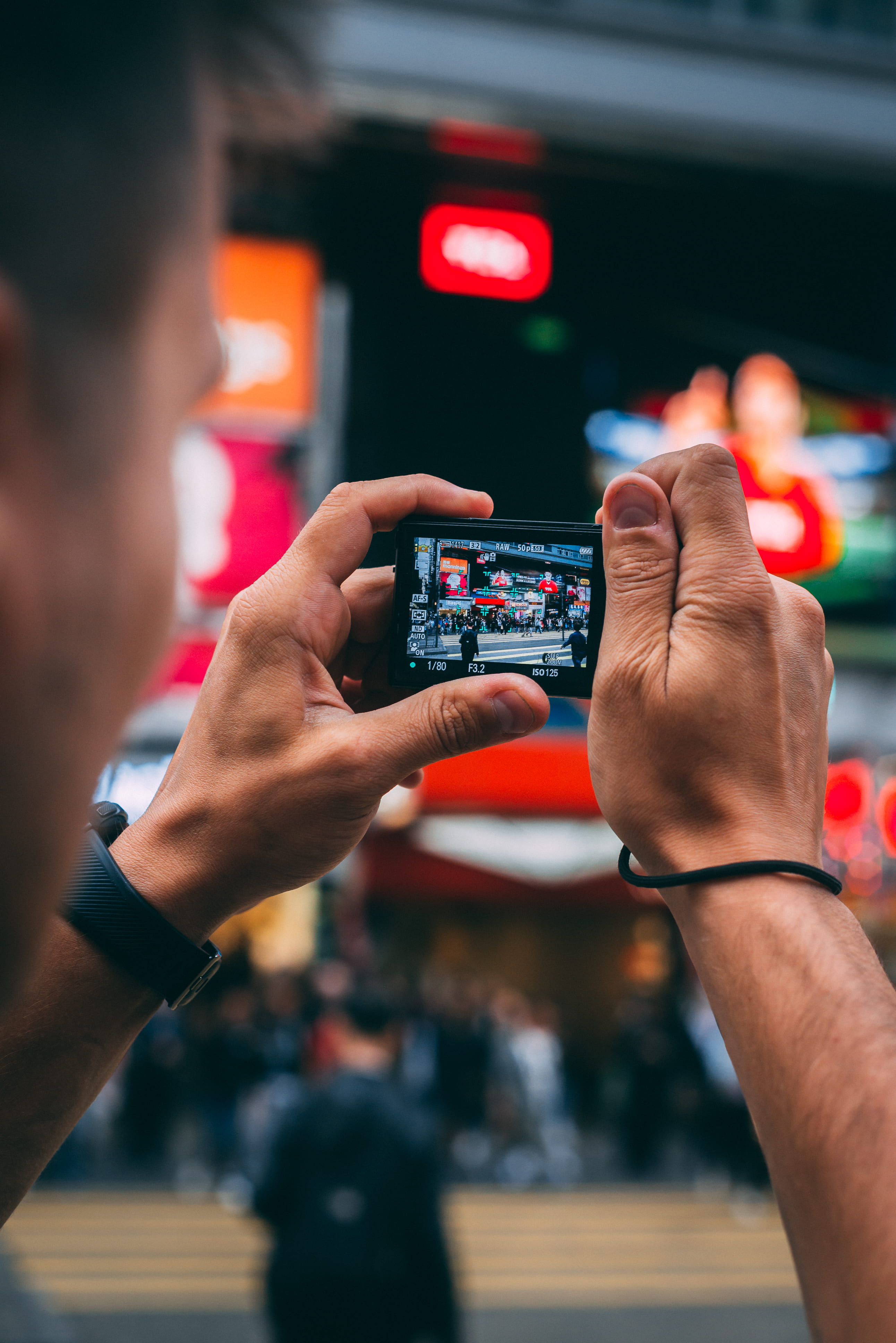 man, holding, men taking photo, photographing, sign, focus on foreground, city, young, taking, making photo, selective, activity, hold, urban, communication, Phone HD Wallpaper