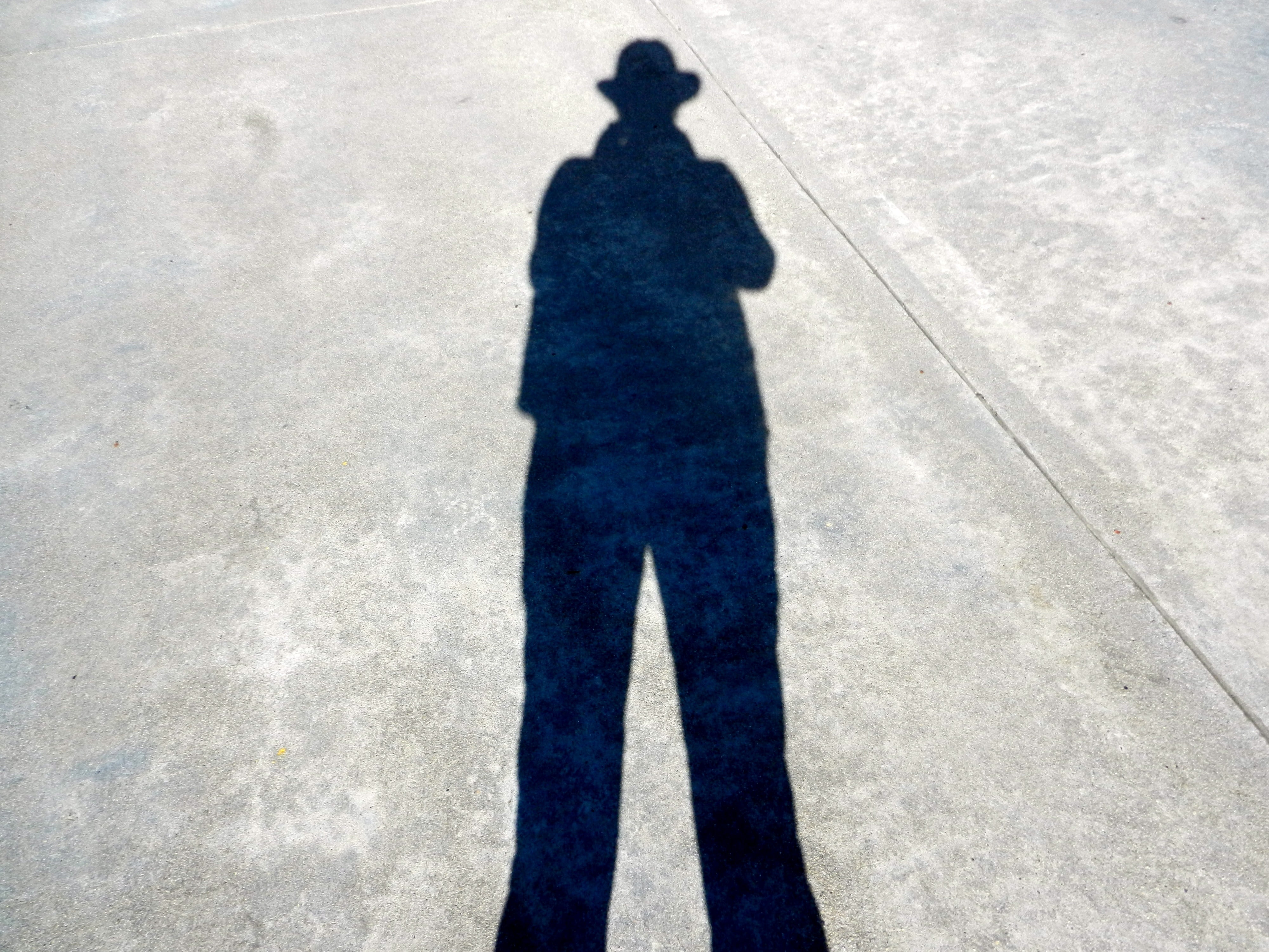 focus on shadow, lifestyles, one person, male, unrecognizable person, city, nature, road, anonymous, real people, men, hat, footpath, sunlight, shadow, HD Wallpaper