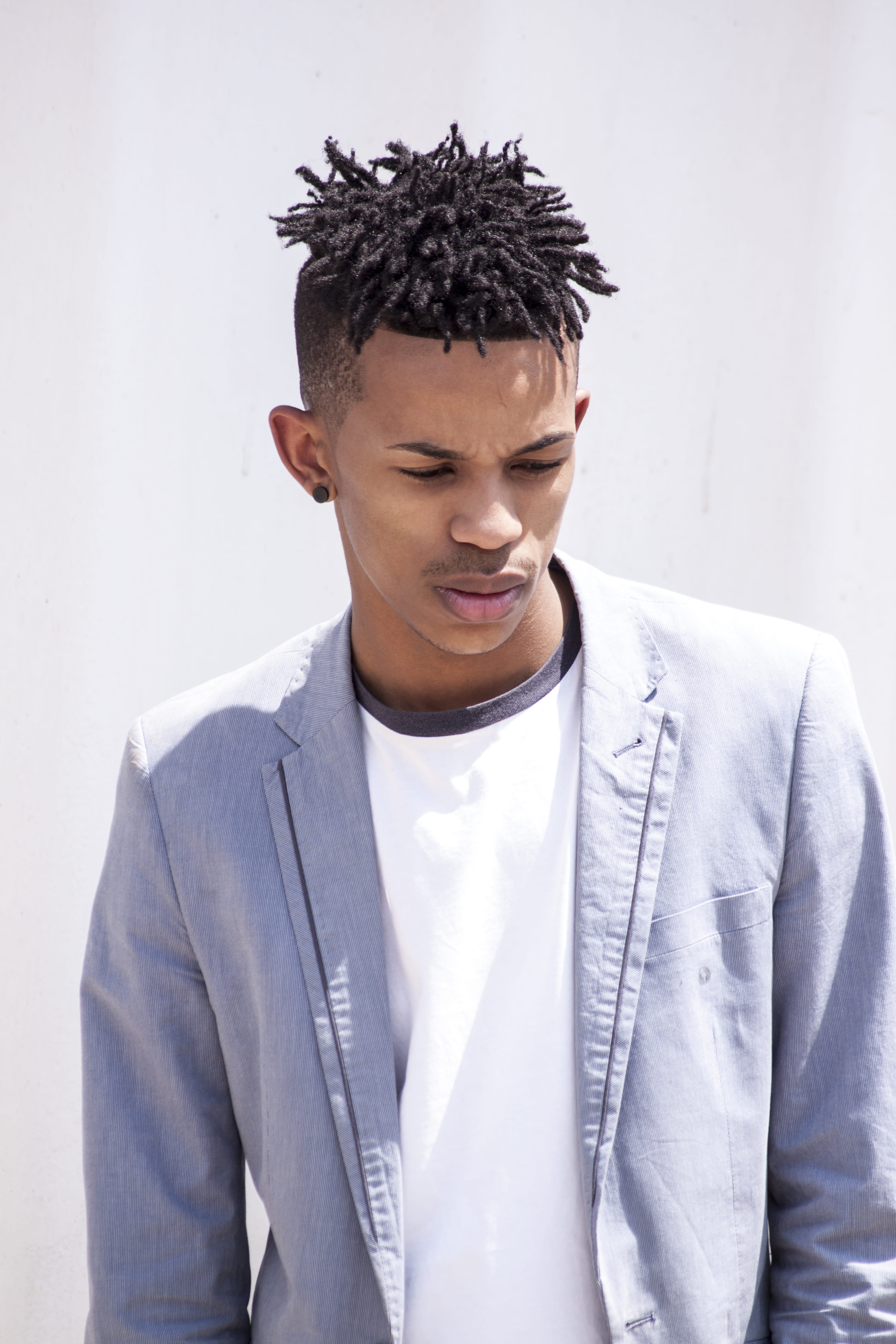 waist up, surface, background, man, portrait, teenager, young men, model, contemplation, young adult, hairstyle, design, poc, behind, white color, notched, Phone HD Wallpaper