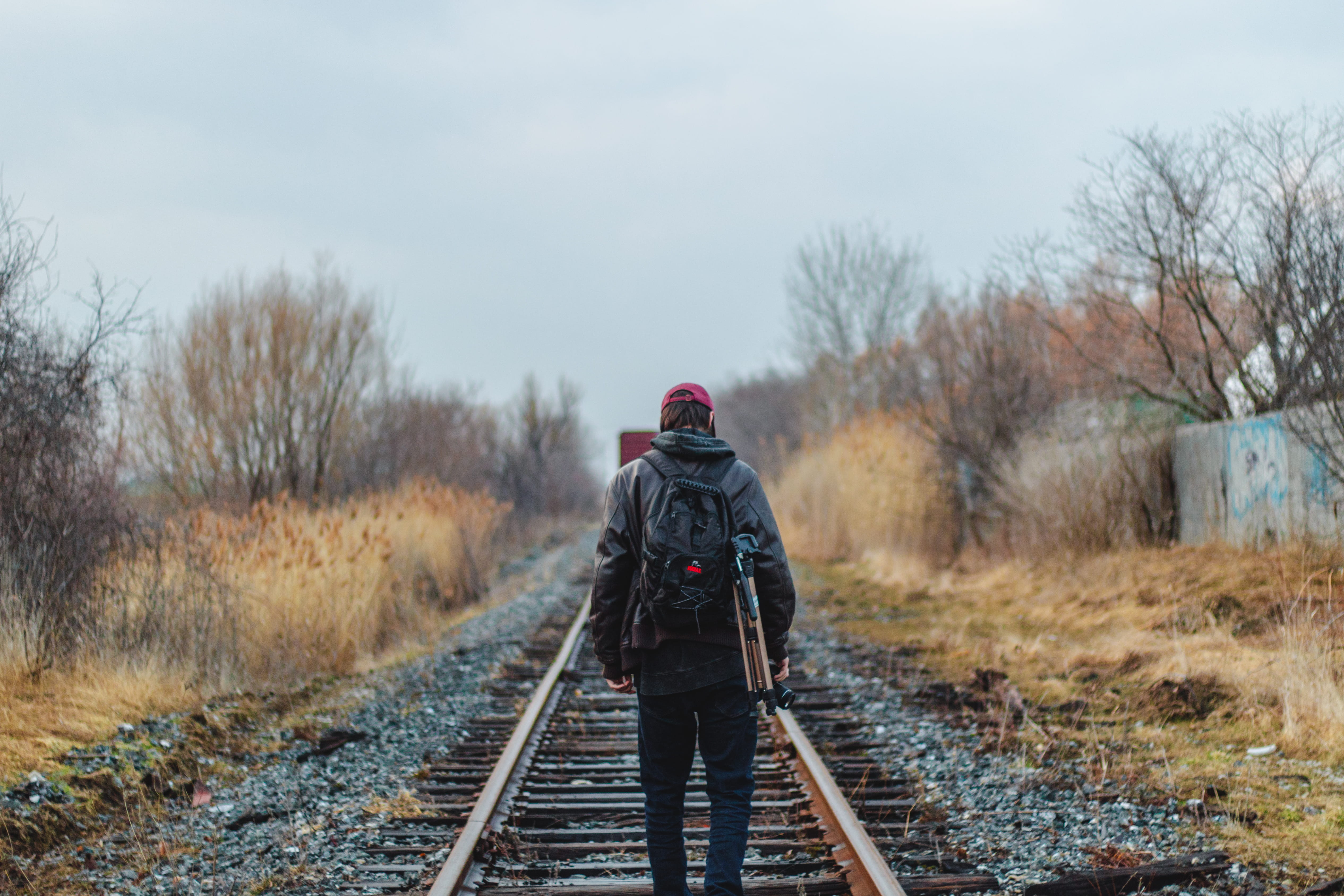 warm clothing, track, wearing, travel, day, walking, plant, journey, nature, human, man, photographer, train track, camera, sky, full length, photo, men, HD Wallpaper