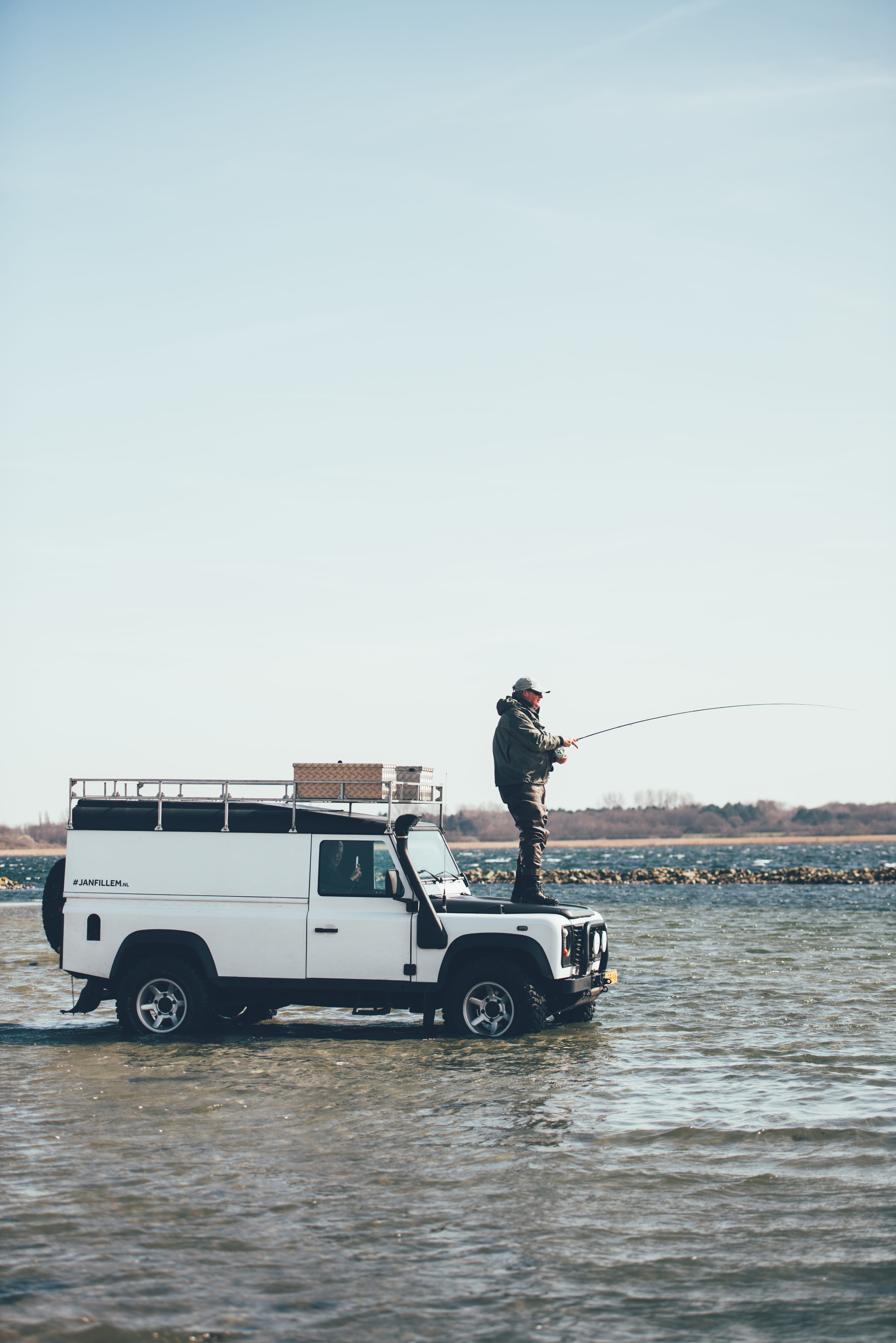 man, land, top, white, water, land vehicle, one person, occupation, suv, outdoors, copy space, real people, holding, hood, 5K, rover, outdoor, side view, Phone HD Wallpaper