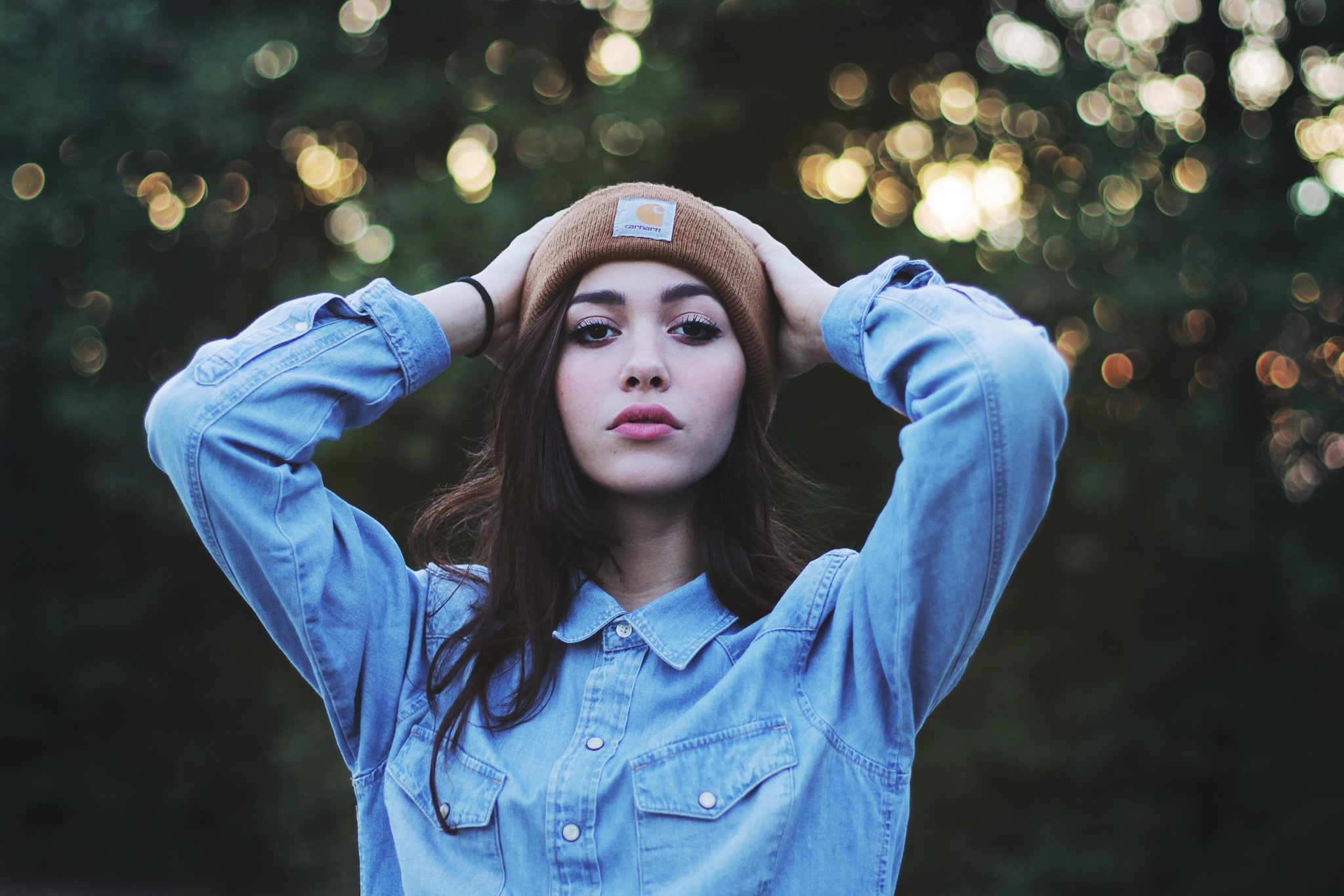 women outdoors, pink lipstick, looking at viewer, women, brunette, beanie, 1080P, hands on head, HD Wallpaper