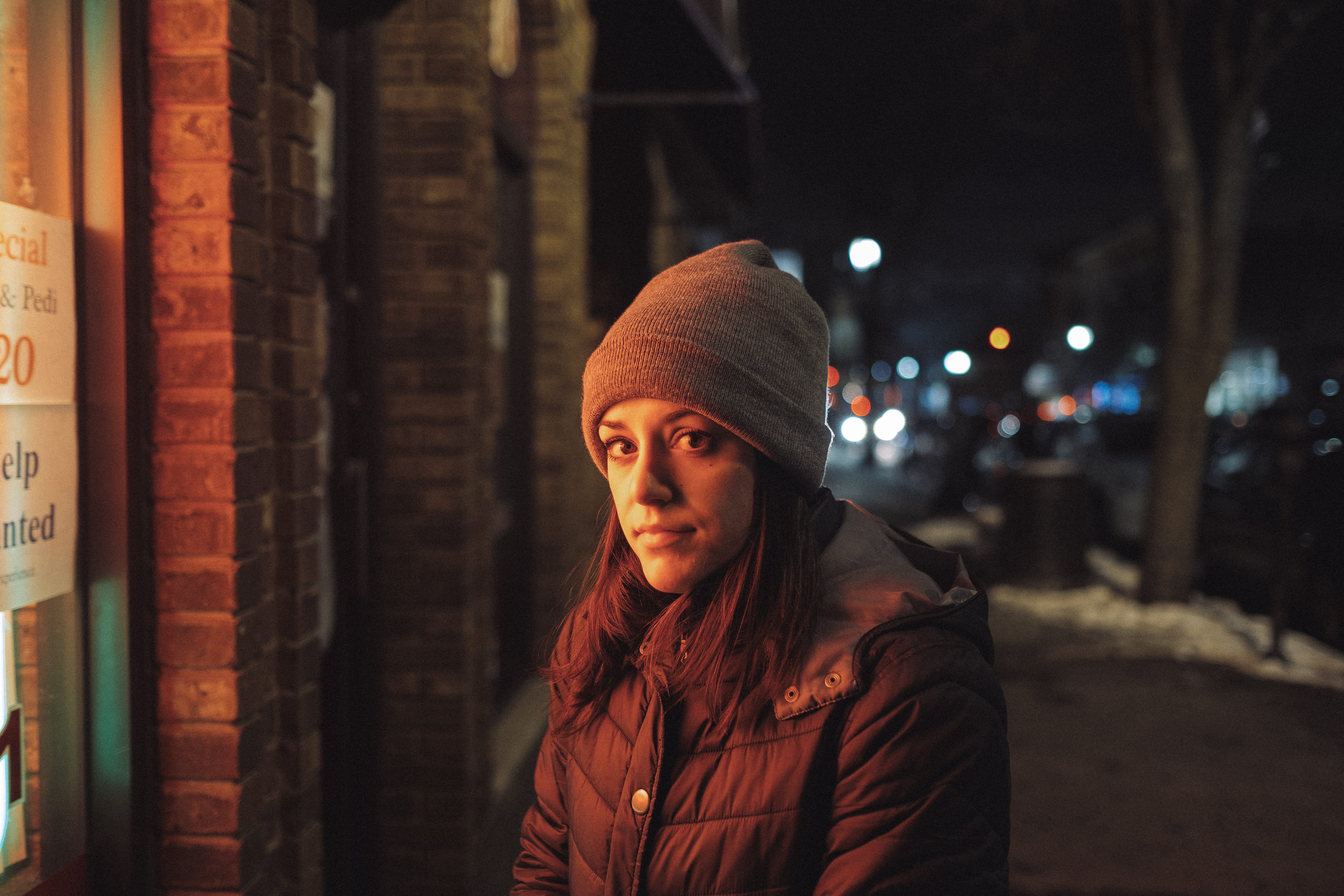 looking at camera, clothing, night, woman, female, city, light, hat, architecture, one person, building, lady, black, leisure activity, young women, orange, HD Wallpaper