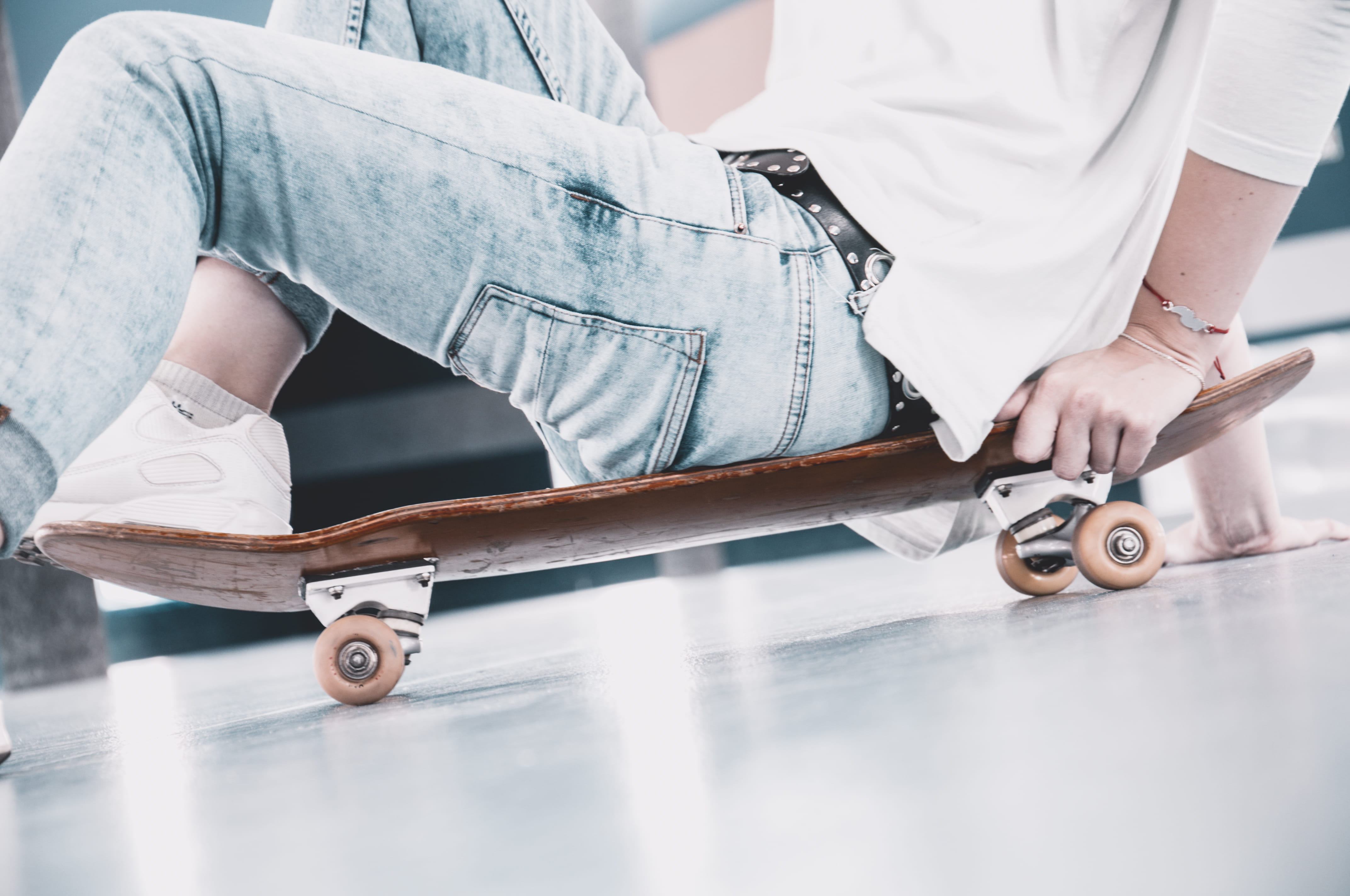 denim wear, day, person, seating on skate, one person, skateboard, faceless, sports equipment, midsection, human body part, low section, jeans, skateboarder, HD Wallpaper