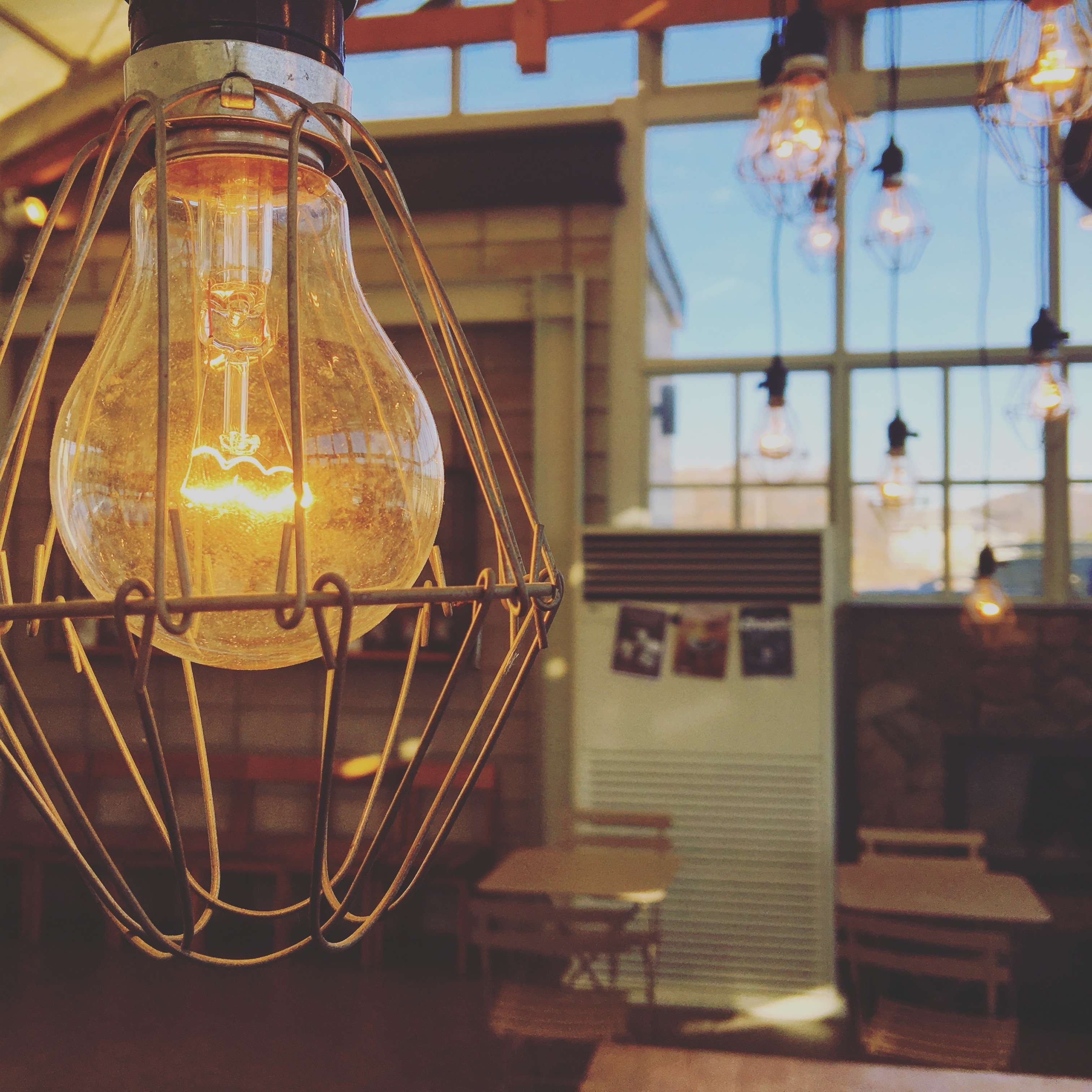 tables, low angle view, electric light, windo, day, decoration, energy, electric, lighting, close up, 2K, hanging, light bulb, chairs, focus on foreground, Phone HD Wallpaper