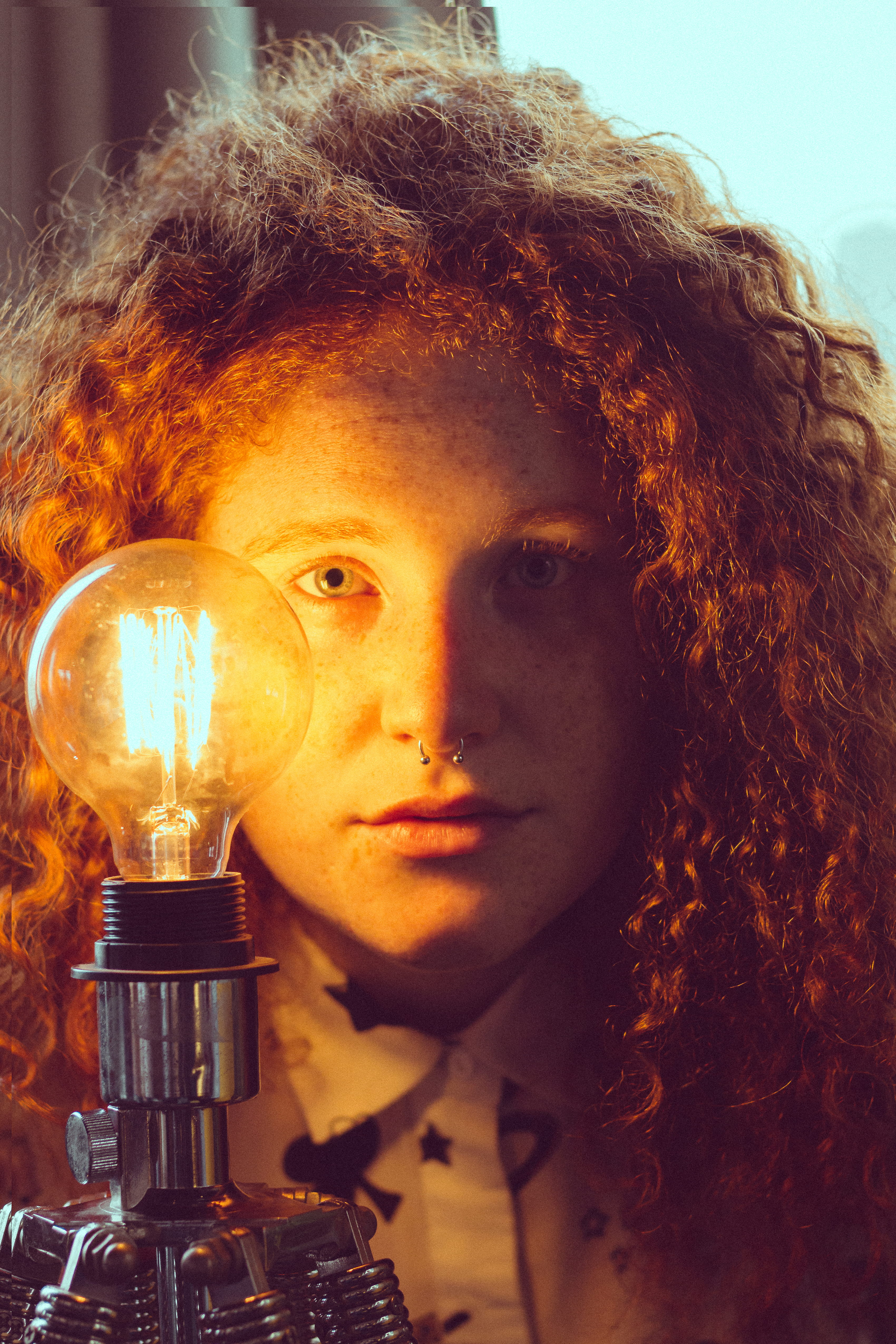 light bulb, headshot, young, glass items, 4K, wear, attractive, near, looking at camera, glass, photoshoot, hairstyle, lighting equipment, lightbulb, curly hair, Phone HD Wallpaper