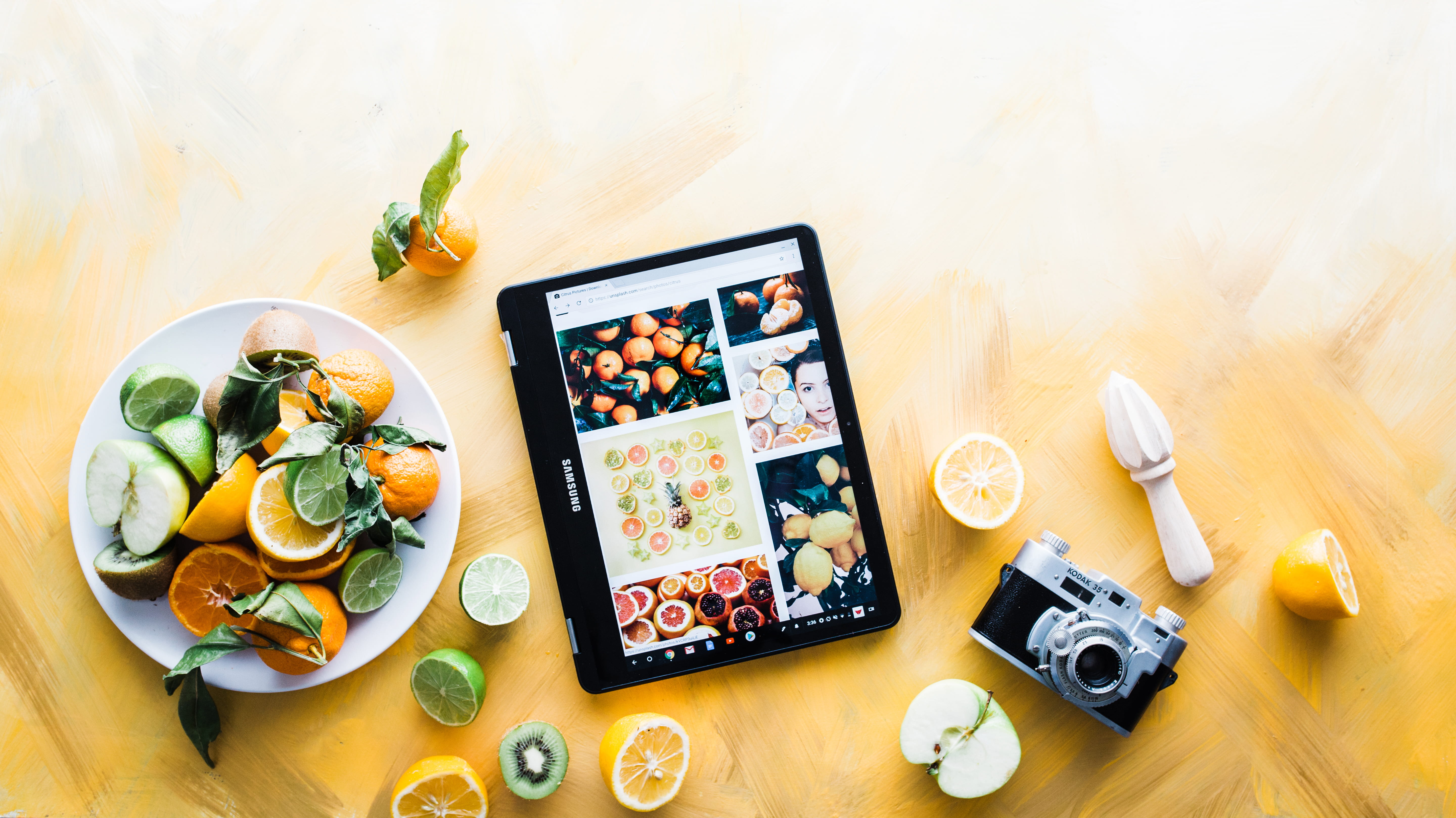 fruits, google chromebooks, high angle view, samsung, beside, wood - material, sponsored, plate, google, indoors, sliced, laptop, directly above, food, HD Wallpaper
