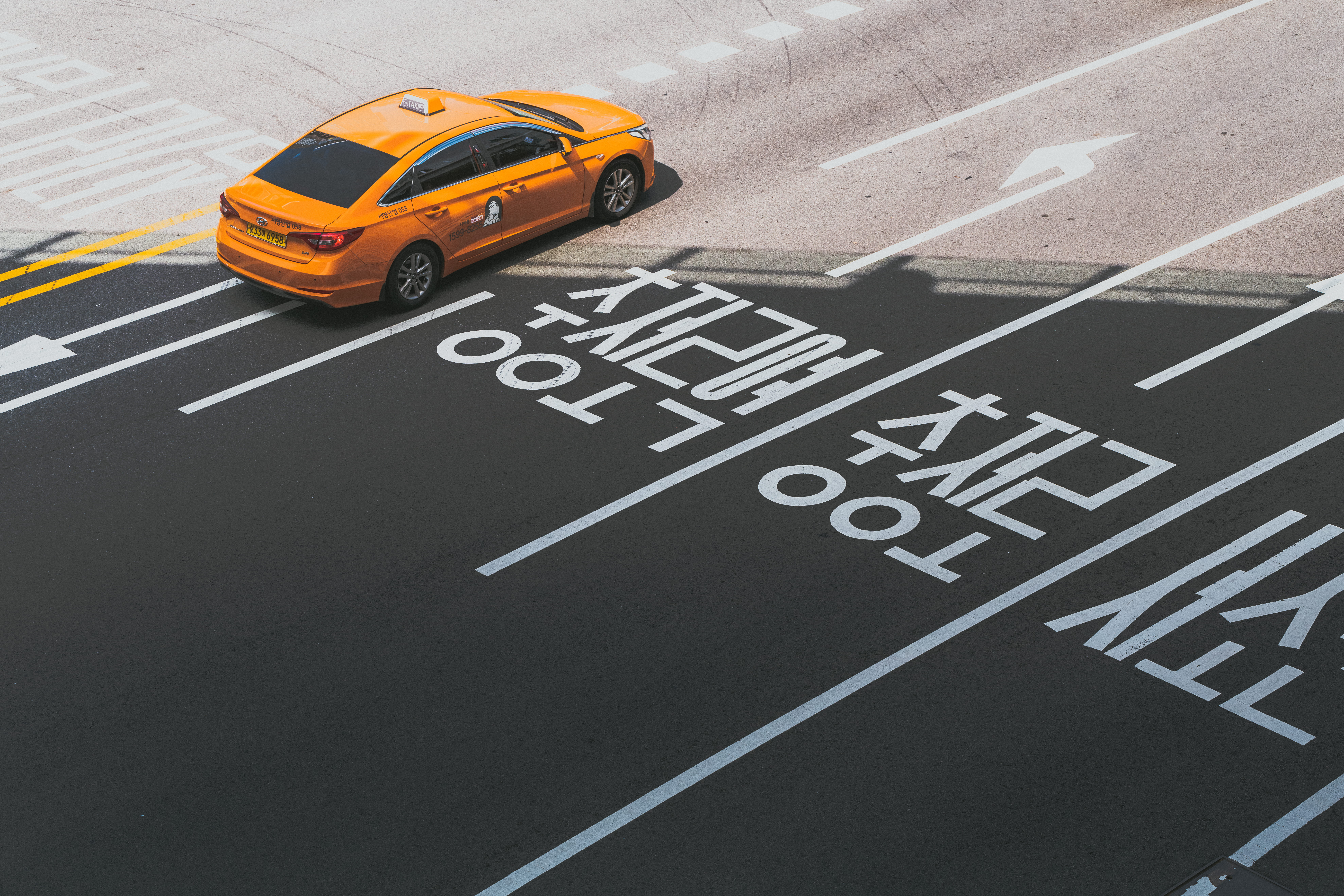motor vehicle, tarmac, text, sign, road, street, overlay, road marking, race car, sedan, motion, south korea, taxi, coupe, machine, orange, symbol, cab, HD Wallpaper