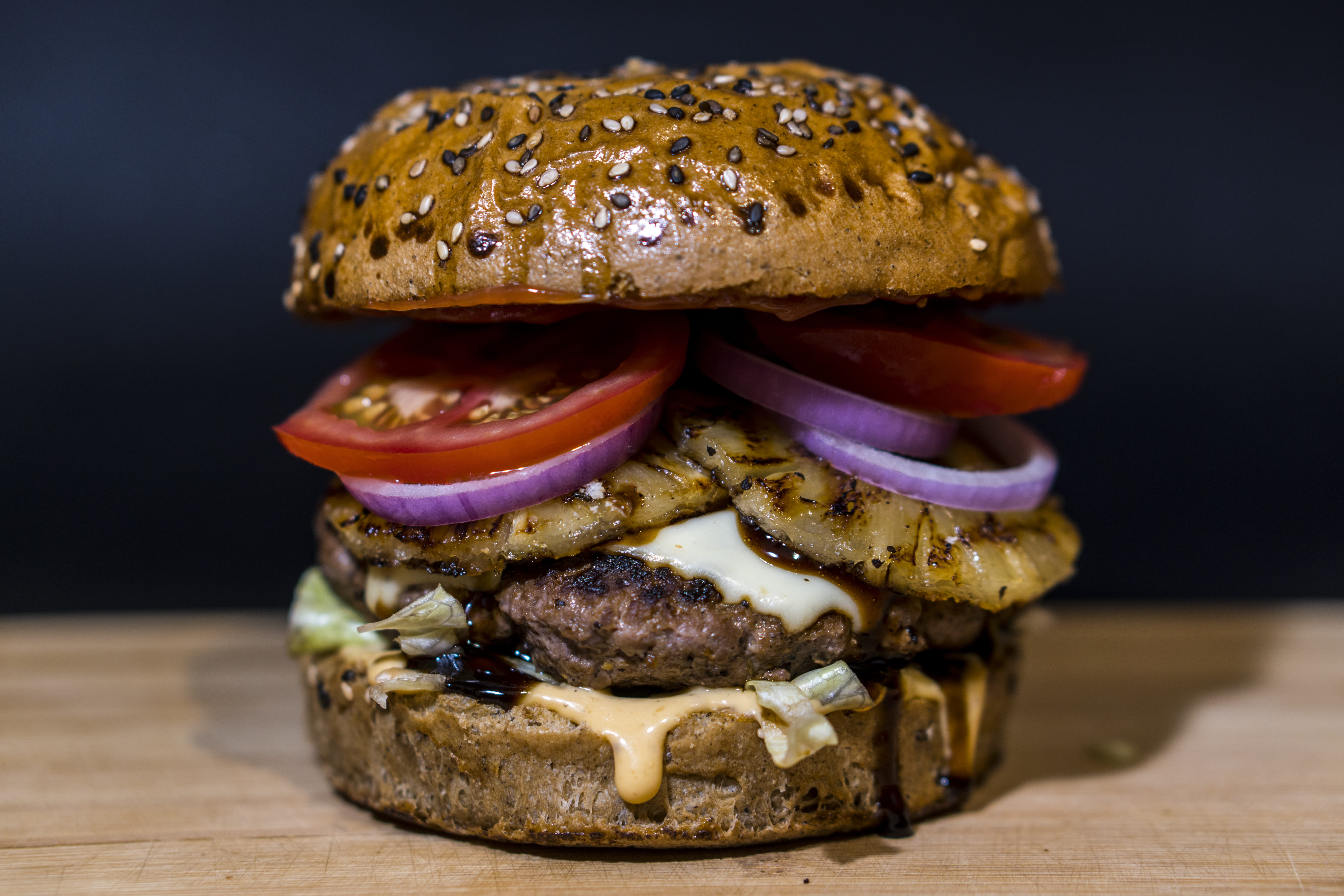 meat, close-up, hamburger, vegetable, 5K, take out food, burger, fast food, pineapple, baked, sandwich, ground beef, indoors, black background, surface, HD Wallpaper