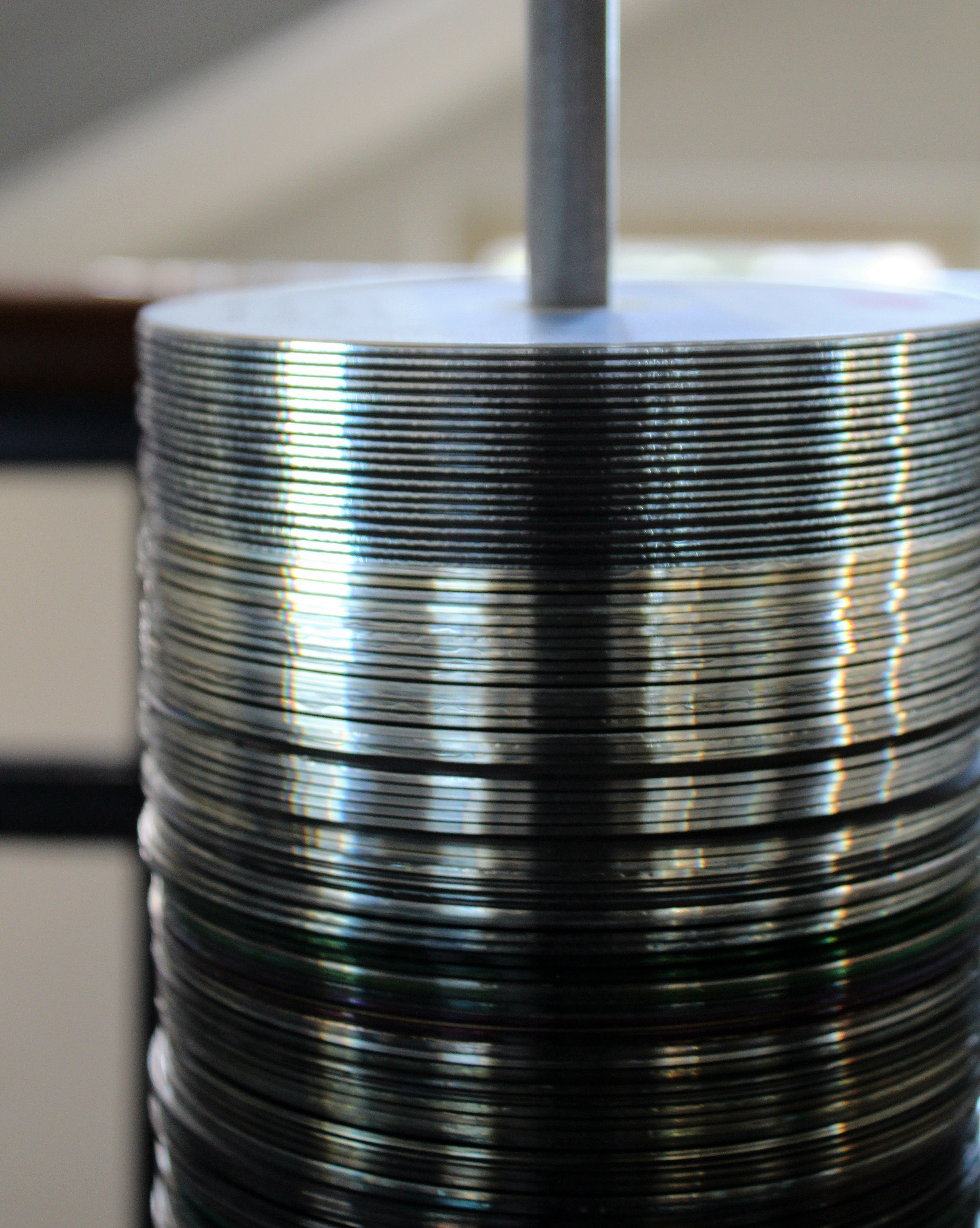 selective focus, aluminum, steel, technology, equipment, alloy, compact disc, business, canned food, 4K, stack, indoors, machine part, data, cd cd rom, Phone HD Wallpaper