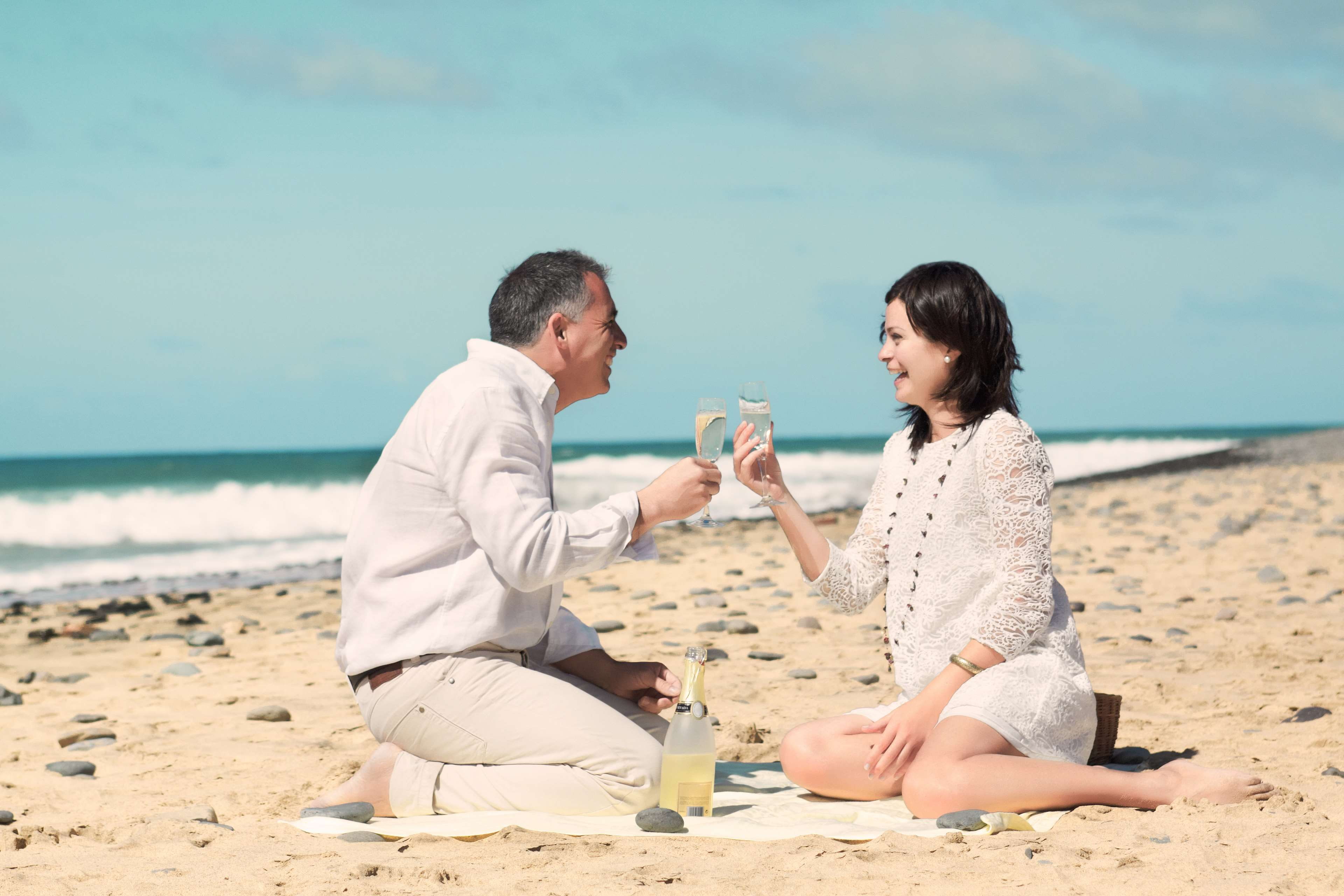 caucasian, cheerful, day, comfortable, emotion, beach, dancing, sitting, sand, couple, beauty, female, men, lifestyles, nature, leisure activity, affectionate, HD Wallpaper