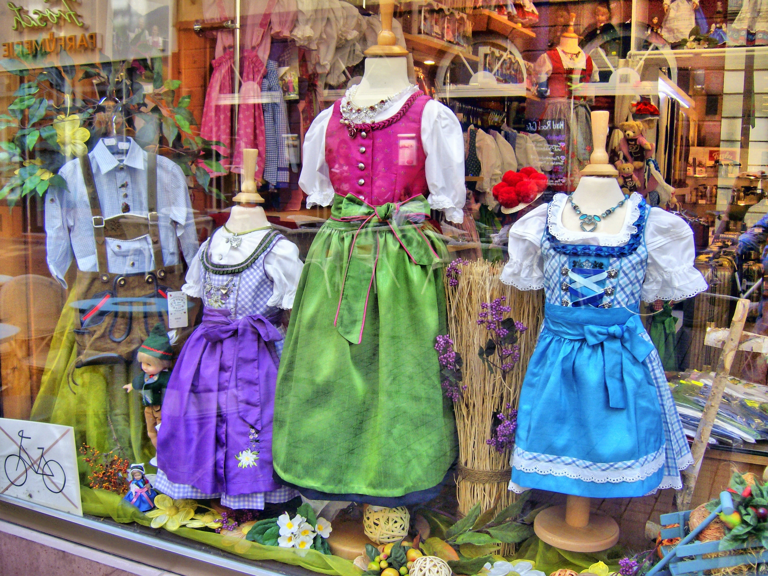 female likeness, window, multi colored, sale, dress, dirndl, clothing, business, human representation, costume, tradition, representation, retail, color, HD Wallpaper