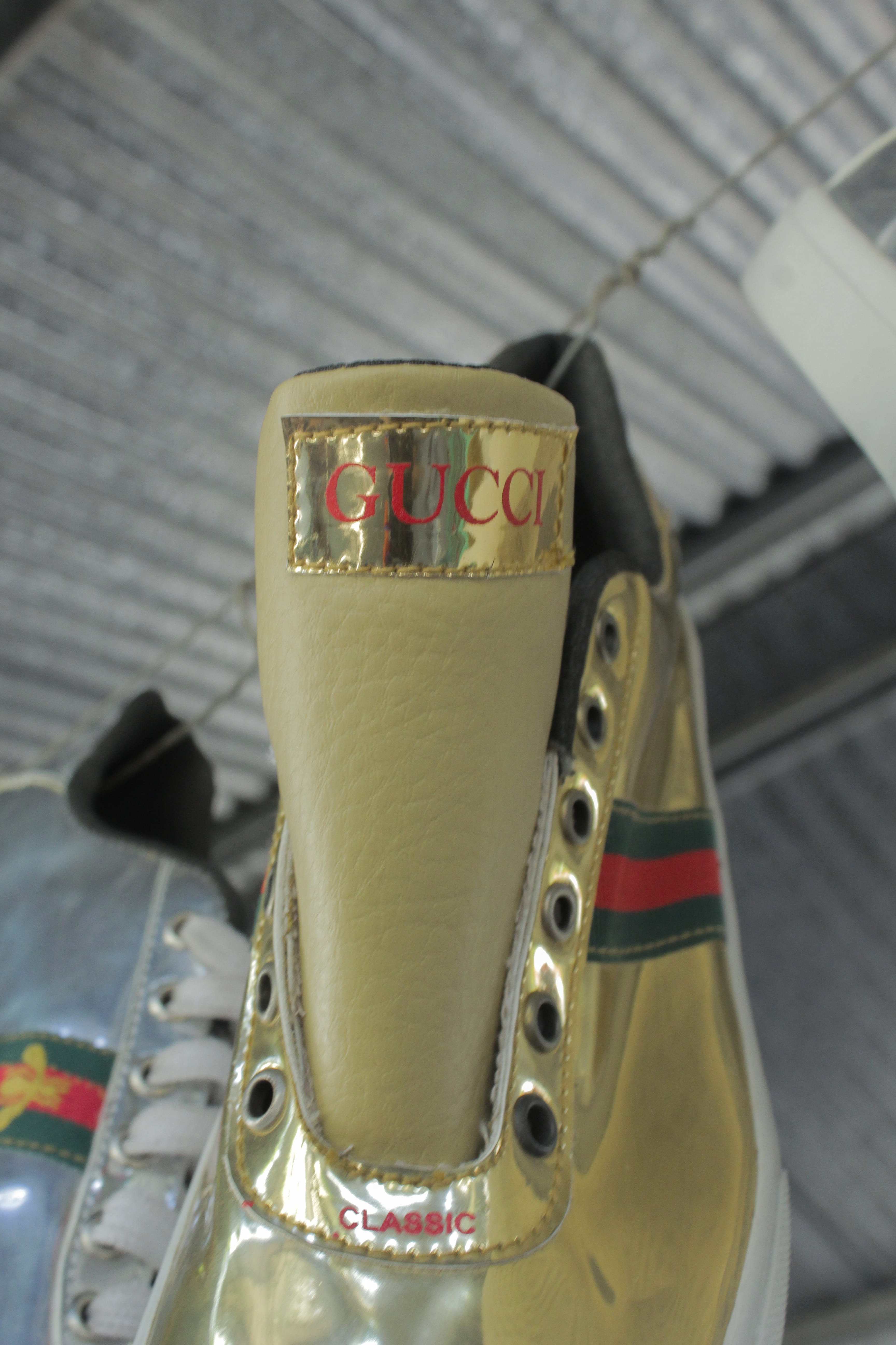trademark, footwear, pattern, two objects, apparel, focus on foreground, close-up, gold, consumerism, western script, fake, indoors, market, accessories, Phone HD Wallpaper