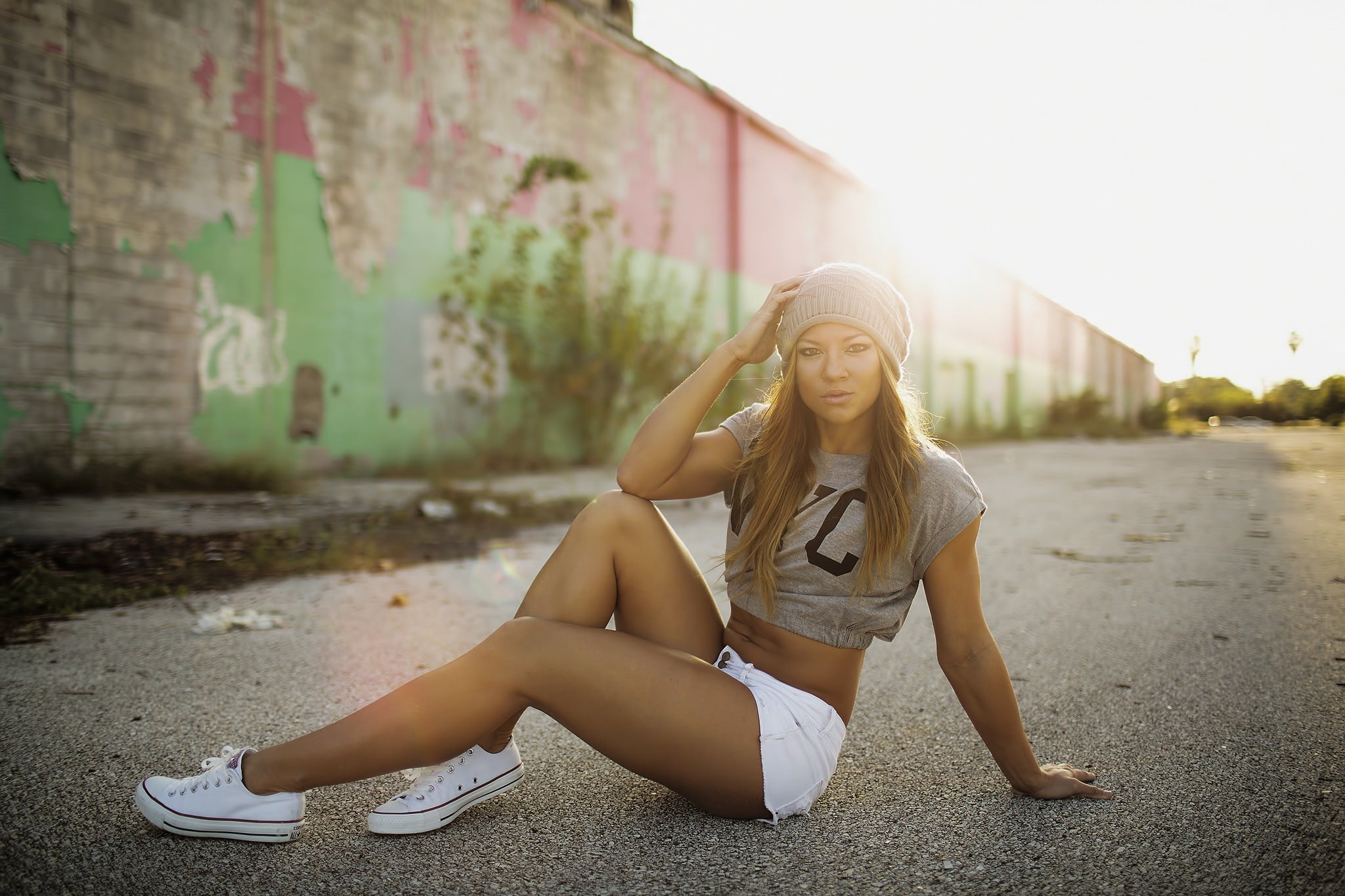 fashion, one person, hairstyle, outdoors, lens flare, jean shorts, young women, beauty, women, real people, portrait, sitting, sunset, road, hat, young adult, HD Wallpaper