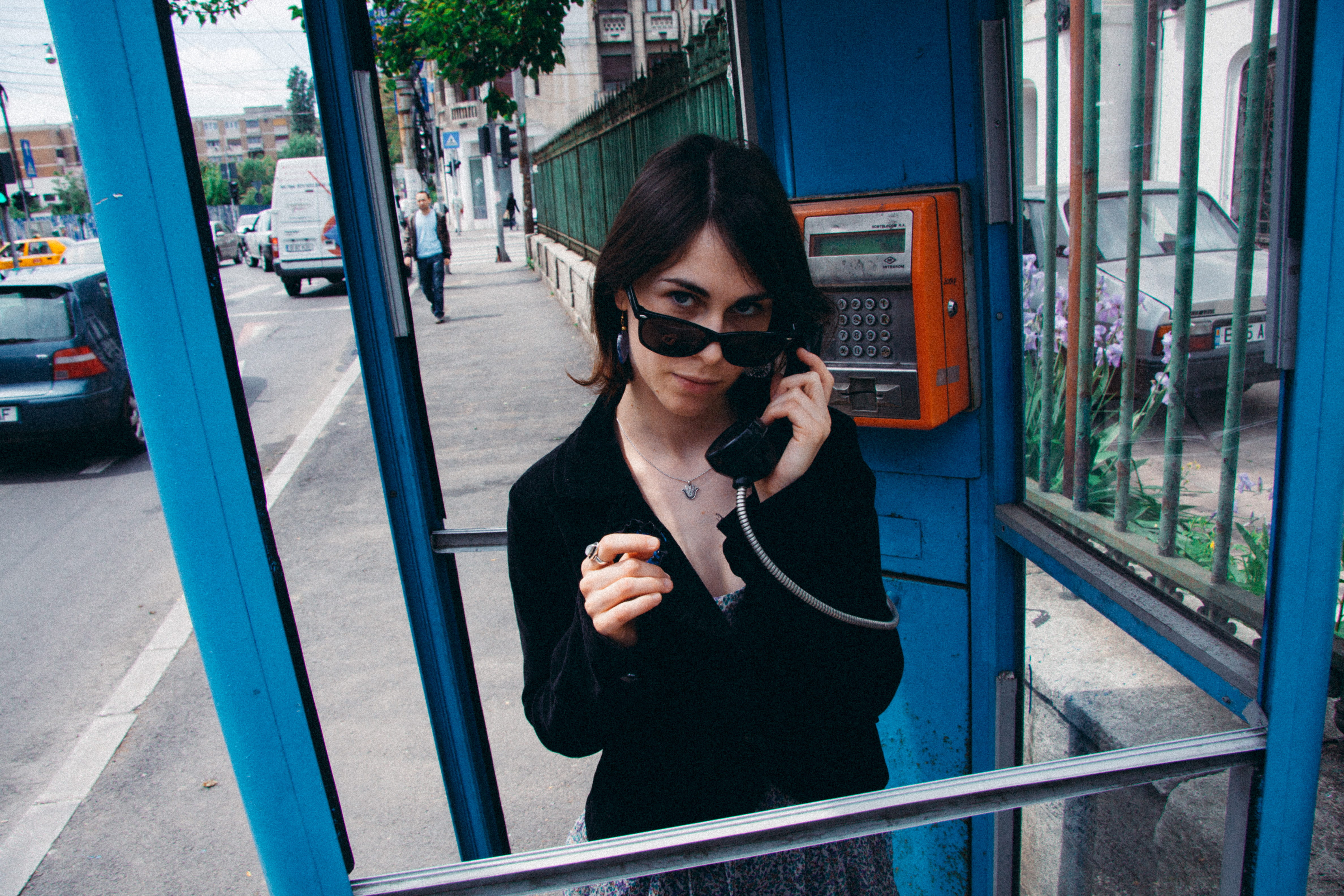 cheerful, front view, smiling, phone booth, beautiful woman, young women, urban Scene, telephone, city Life, business, technology, sunglasses, waist up, HD Wallpaper