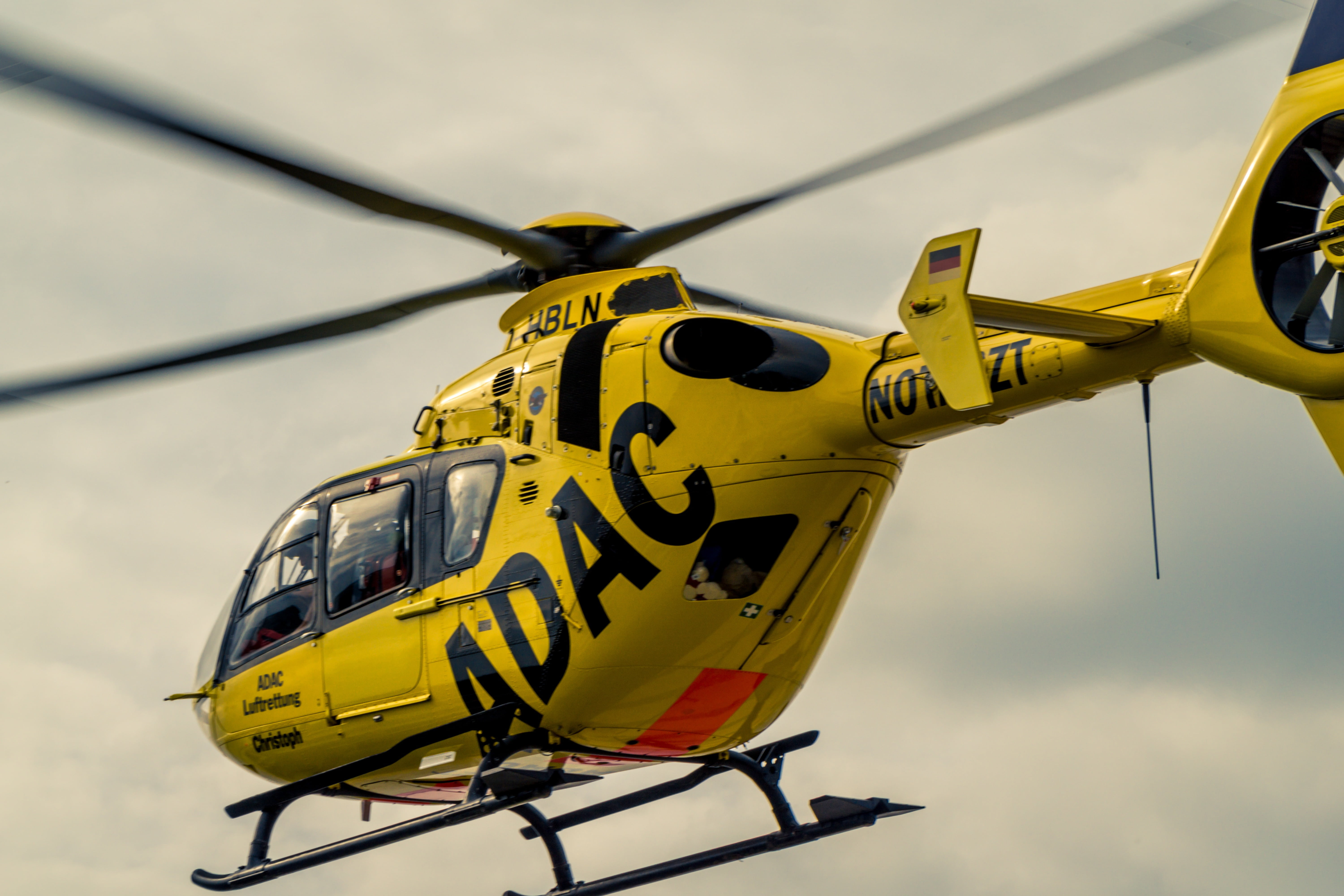 air rescue, doctor on call, outdoors, yellow angel, aerospace industry, 5K, close-up, motion, help, nature, day, accident rescue, no people, airshow, focus on foreground, HD Wallpaper