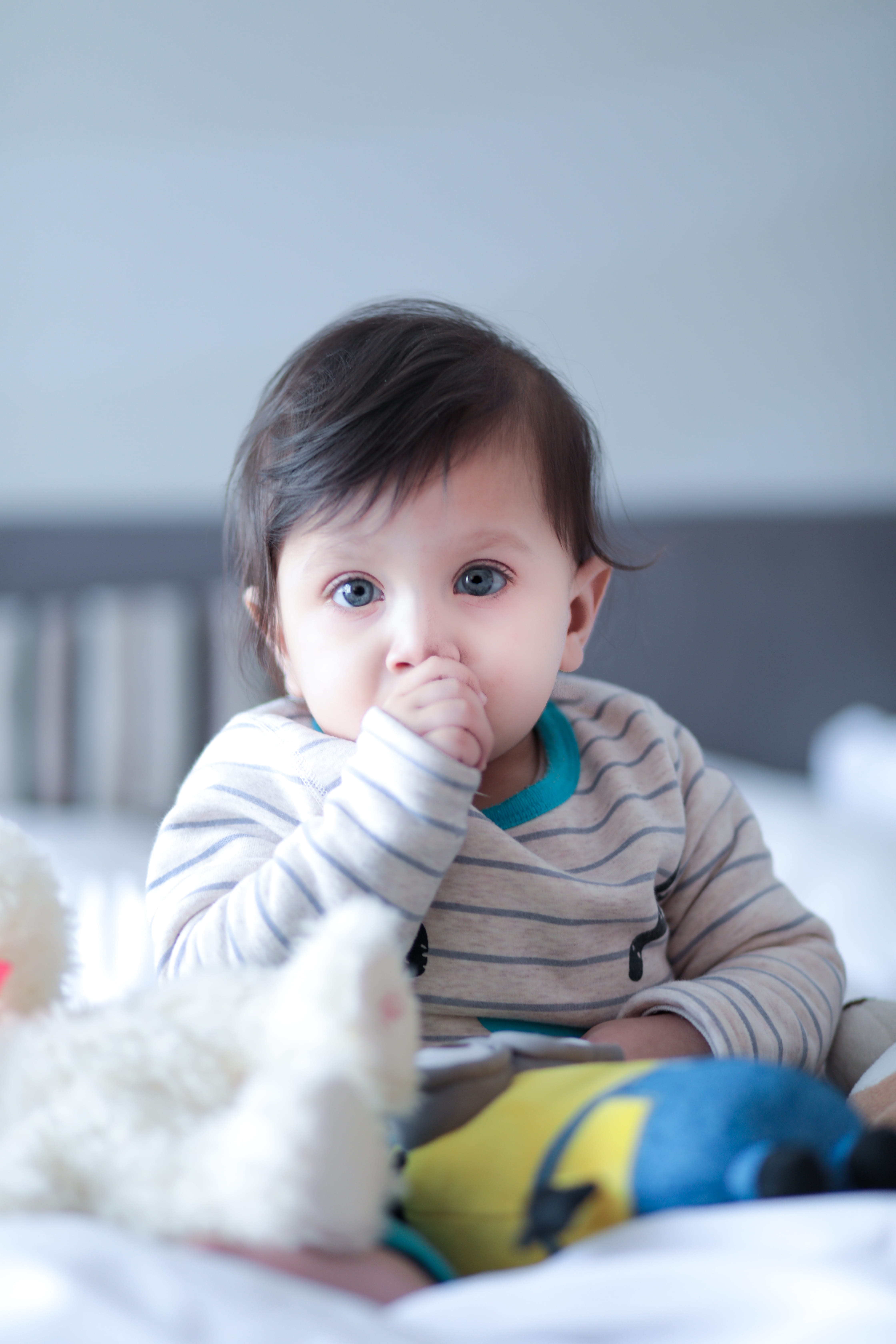 front view, baby, person, big eyes, little, indoors, real people, cute, childhood, food and drink, toddler, thumb, portrait, young, 5K, sitting, child, Phone HD Wallpaper