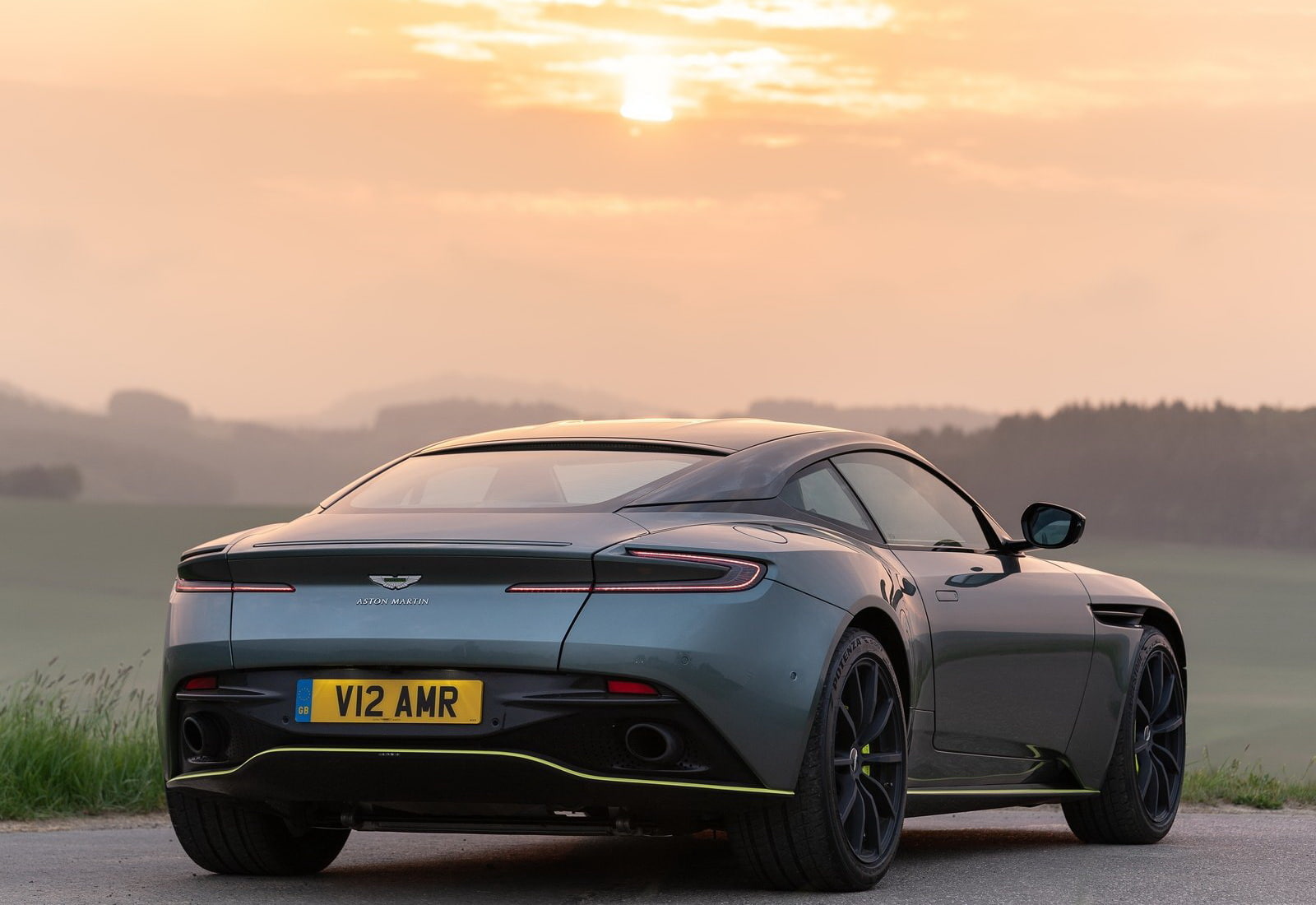 db11, road trip, road, mountain, environment, sports car, 720P, travel, transportation, car, outdoors, focus on foreground, sunlight, mode of transportation, HD Wallpaper