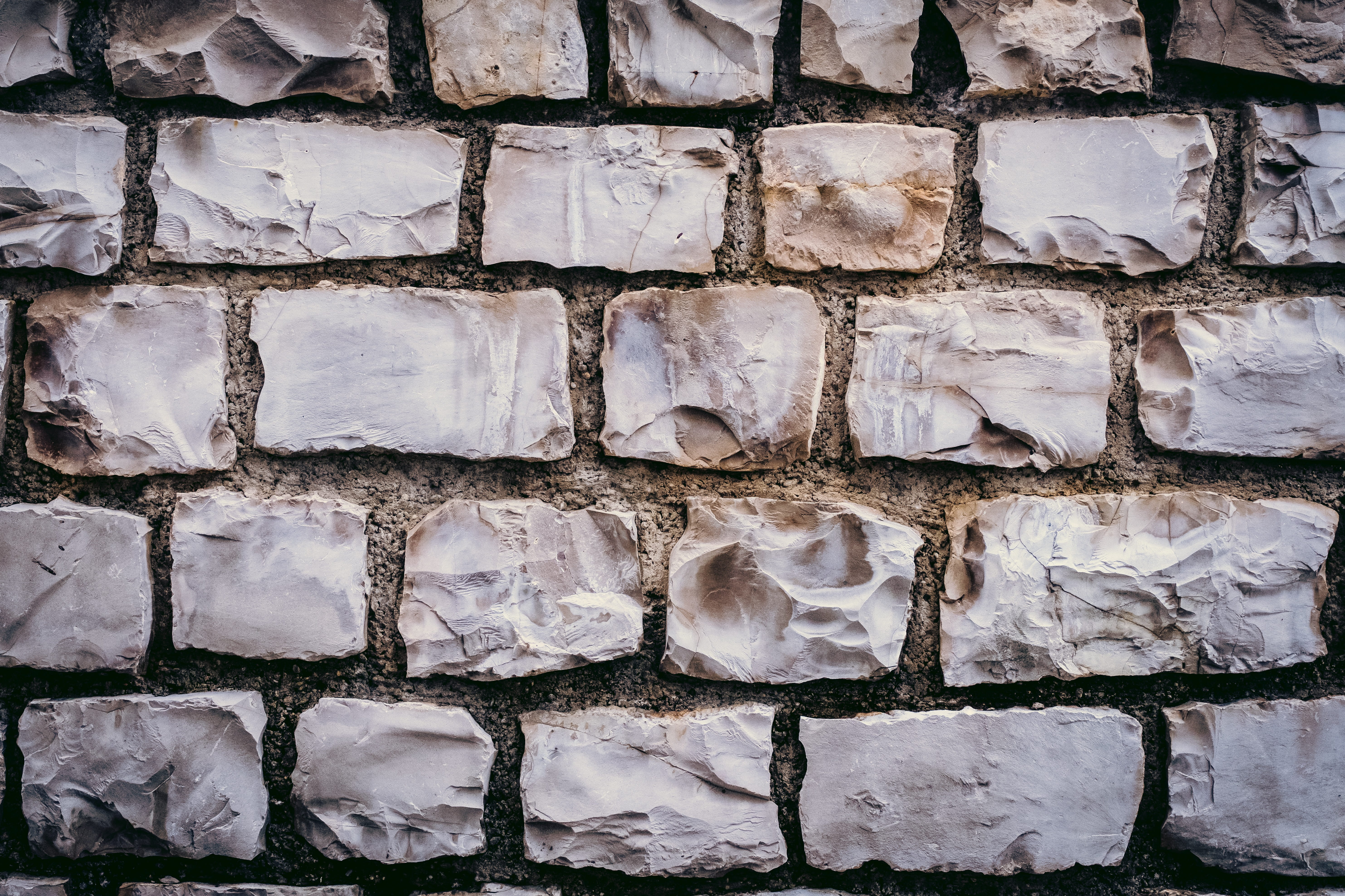 no people, textured, large group of objects, full frame, brown, in a row, solid, backgrounds, 5K, brick, structure, old, gray, rough, rocks, stone material, HD Wallpaper