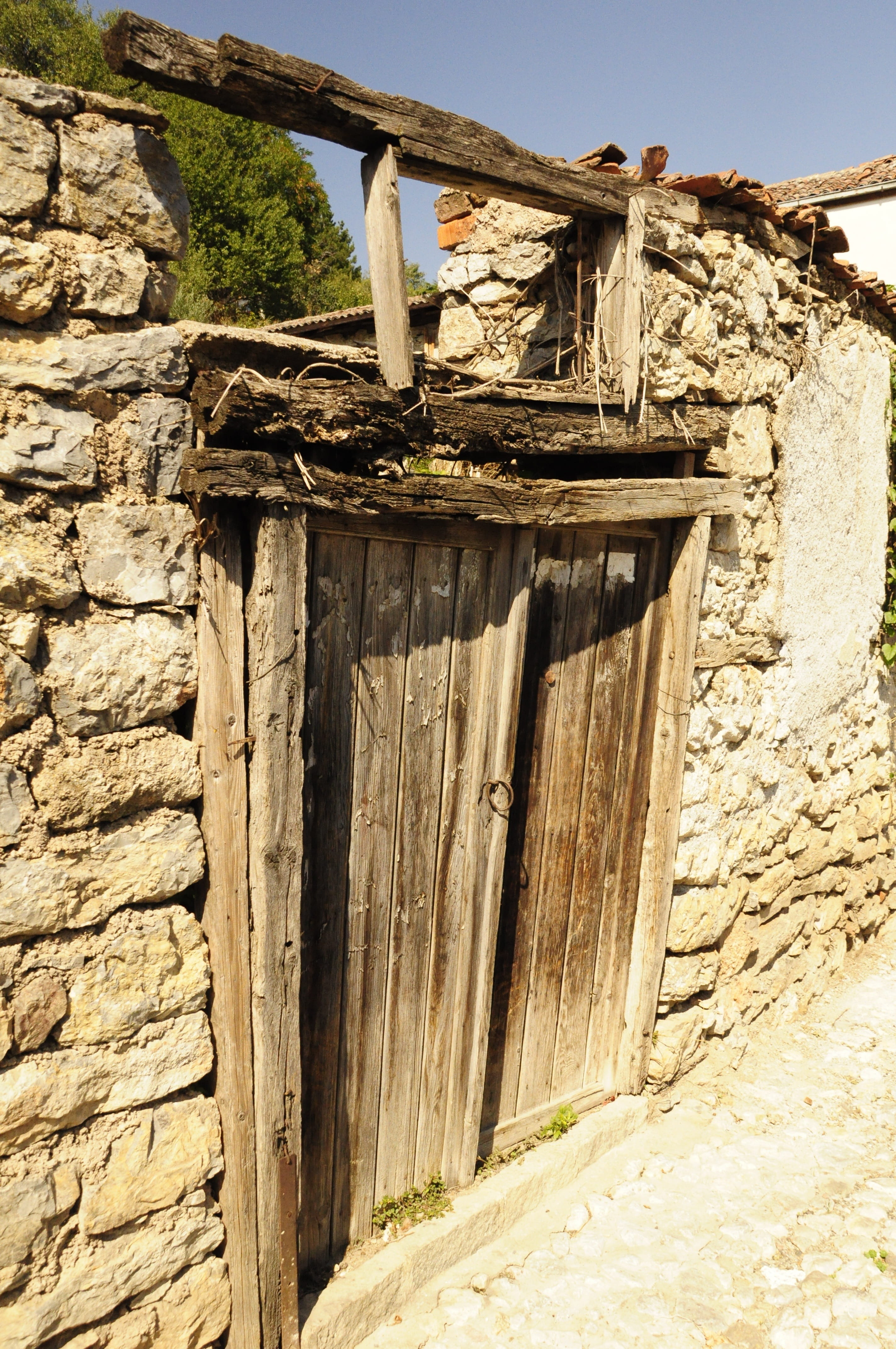 low angle view, weathered, door, history, day, wall - building feature, building exterior, old, wall, building, nature, stone wall, built structure, sky, Phone HD Wallpaper