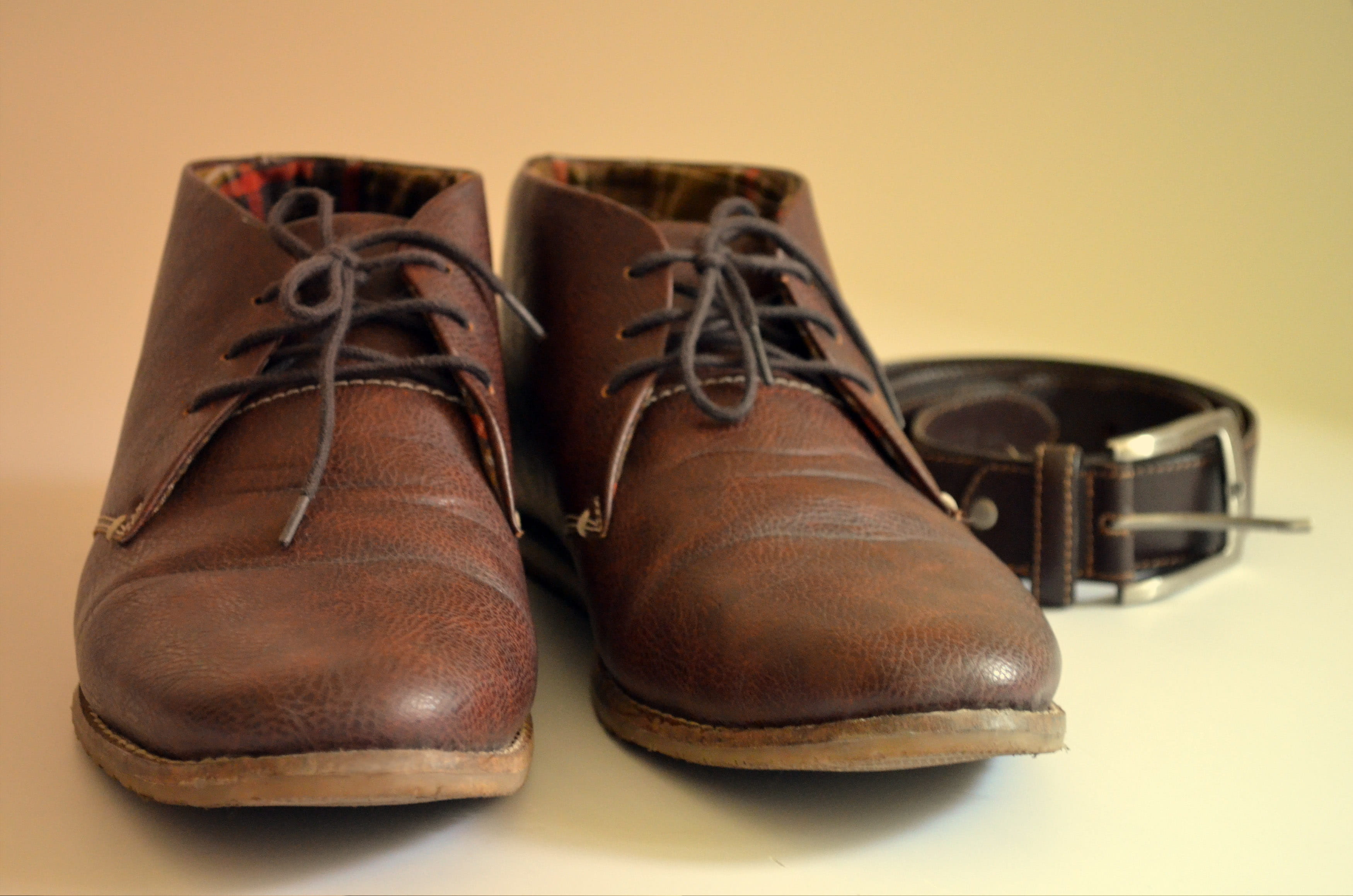 colored background, lace - fastener, shoe, beige background, travel, still life, leather, absence, bootstarp, relaxation, journey, brown, no people, dress shoe, HD Wallpaper