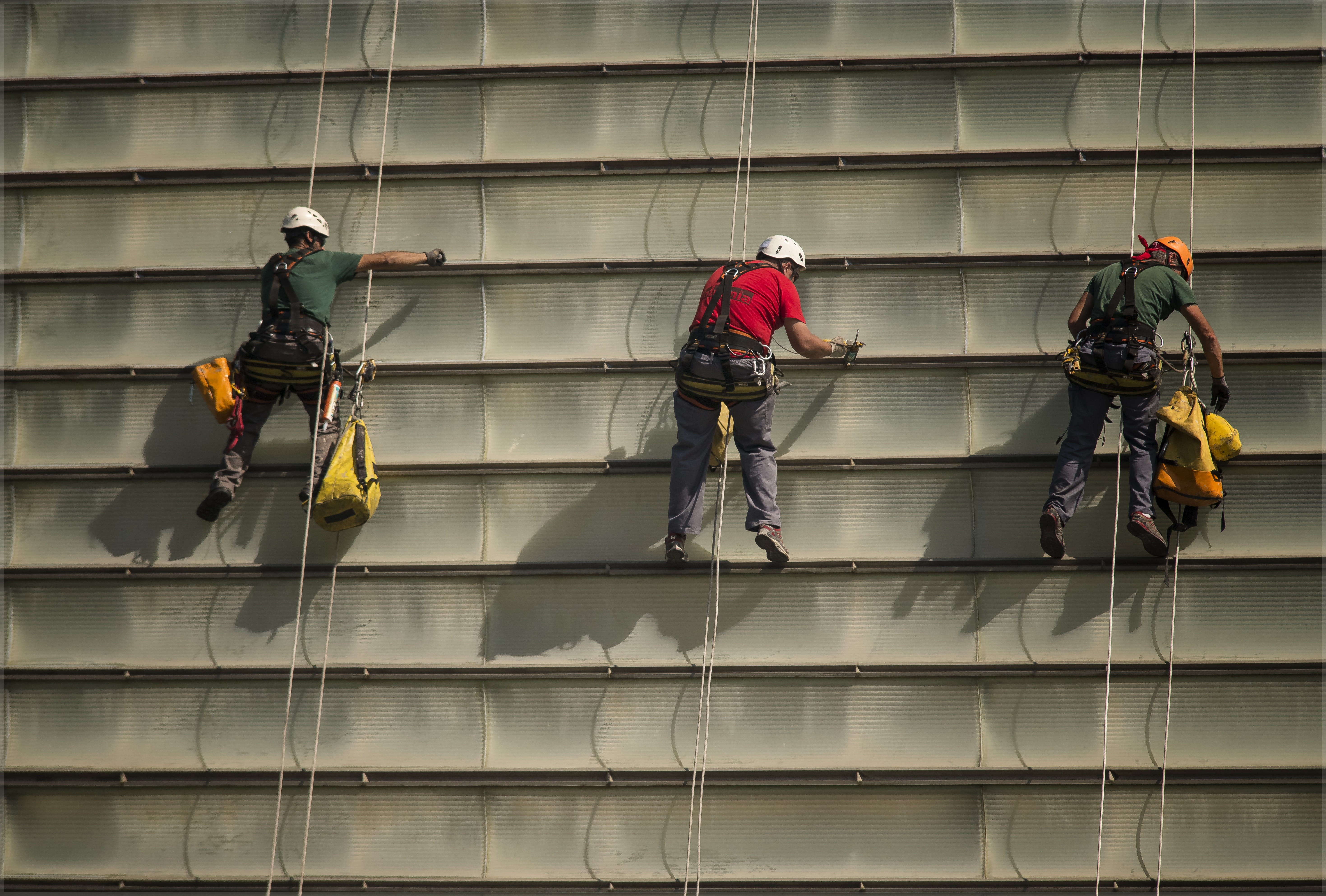 three, women, men, architecture, walking, outdoors, tecnica, prevention, casual clothing, person, helmet, day, full length, group of people, cleaning, built structure, HD Wallpaper