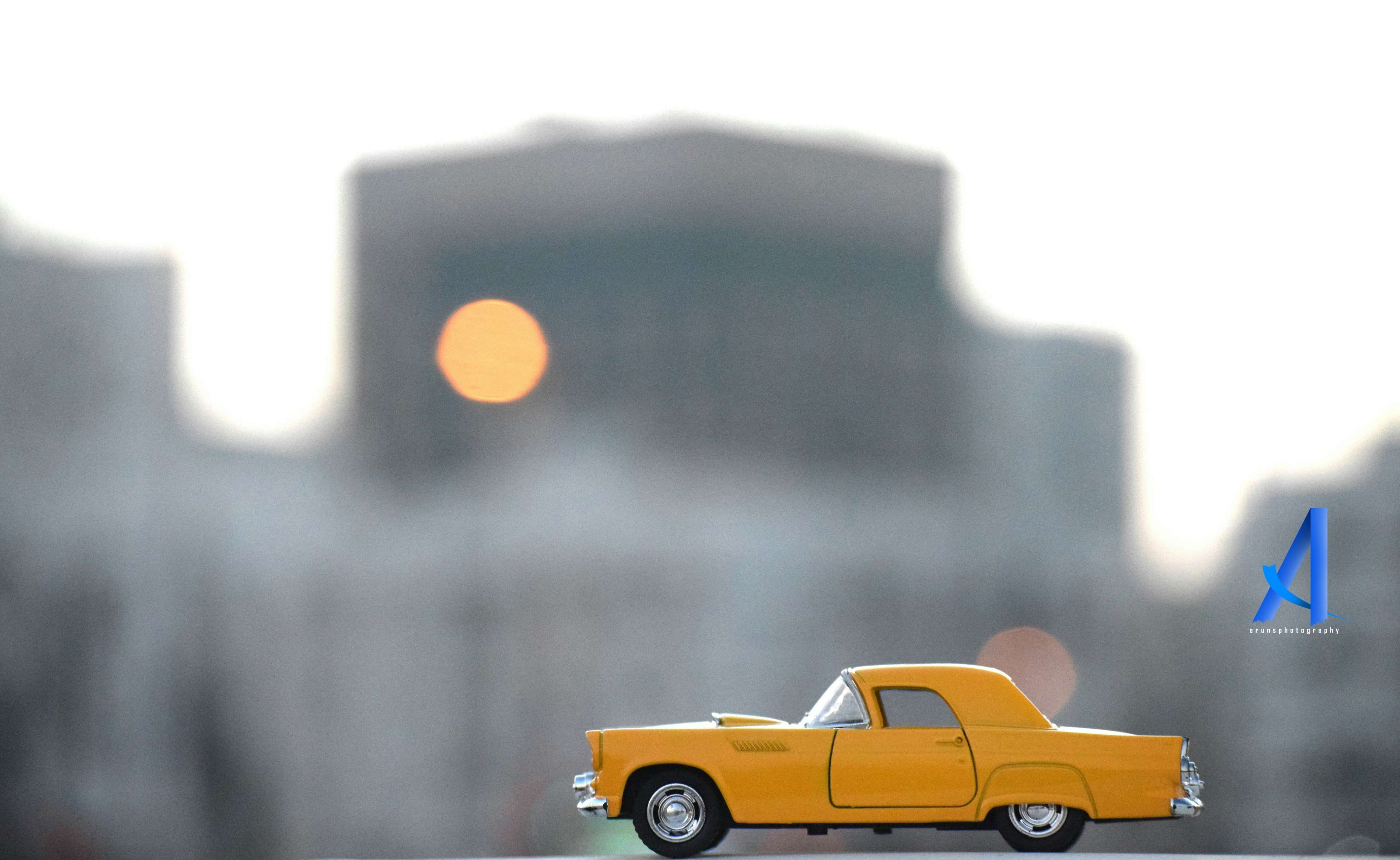 day, building exterior, 4K, built structure, city life, mode of transportation, motor vehicle, no people, city, yellow car, rain, vintage car, skyscraper, HD Wallpaper