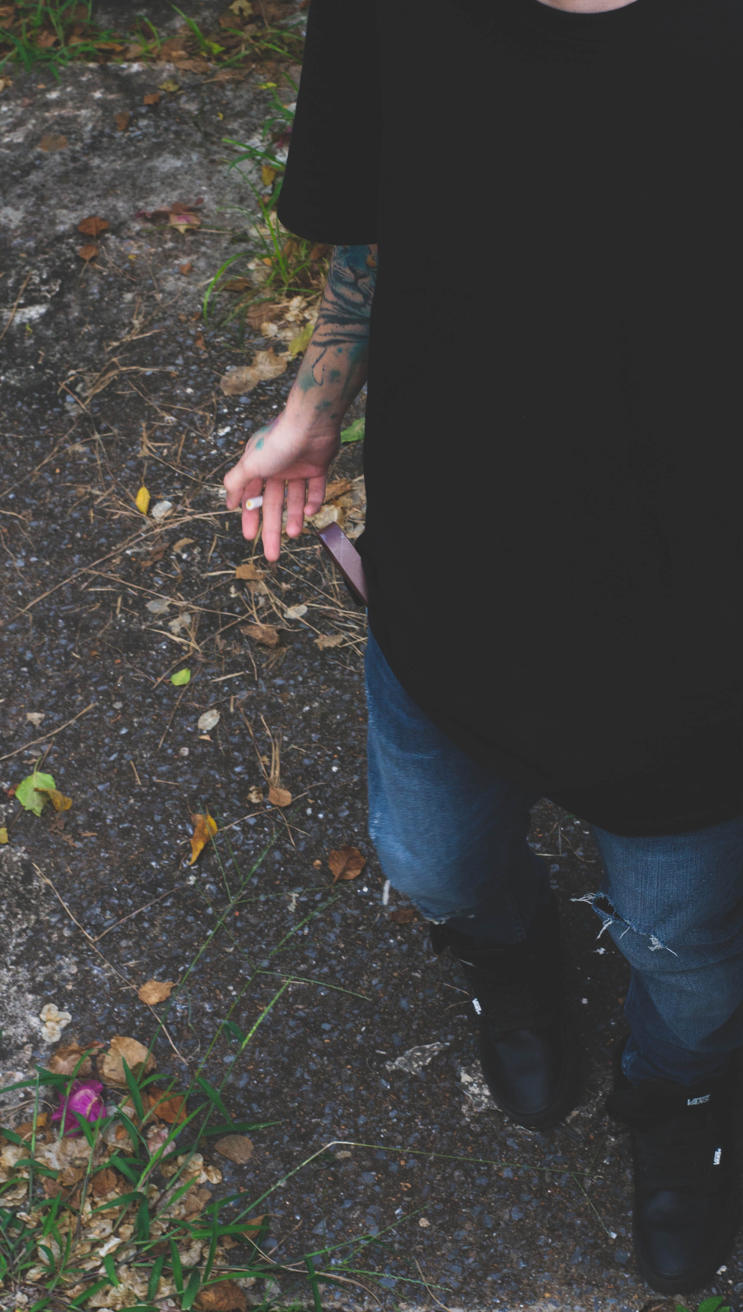 dirt road, arm, leaves, plant, 4K, hand, nature, low section, body part, denim, real people, leaf, human body part, lifestyles, asphalt, shoe, day, plant part, Phone HD Wallpaper