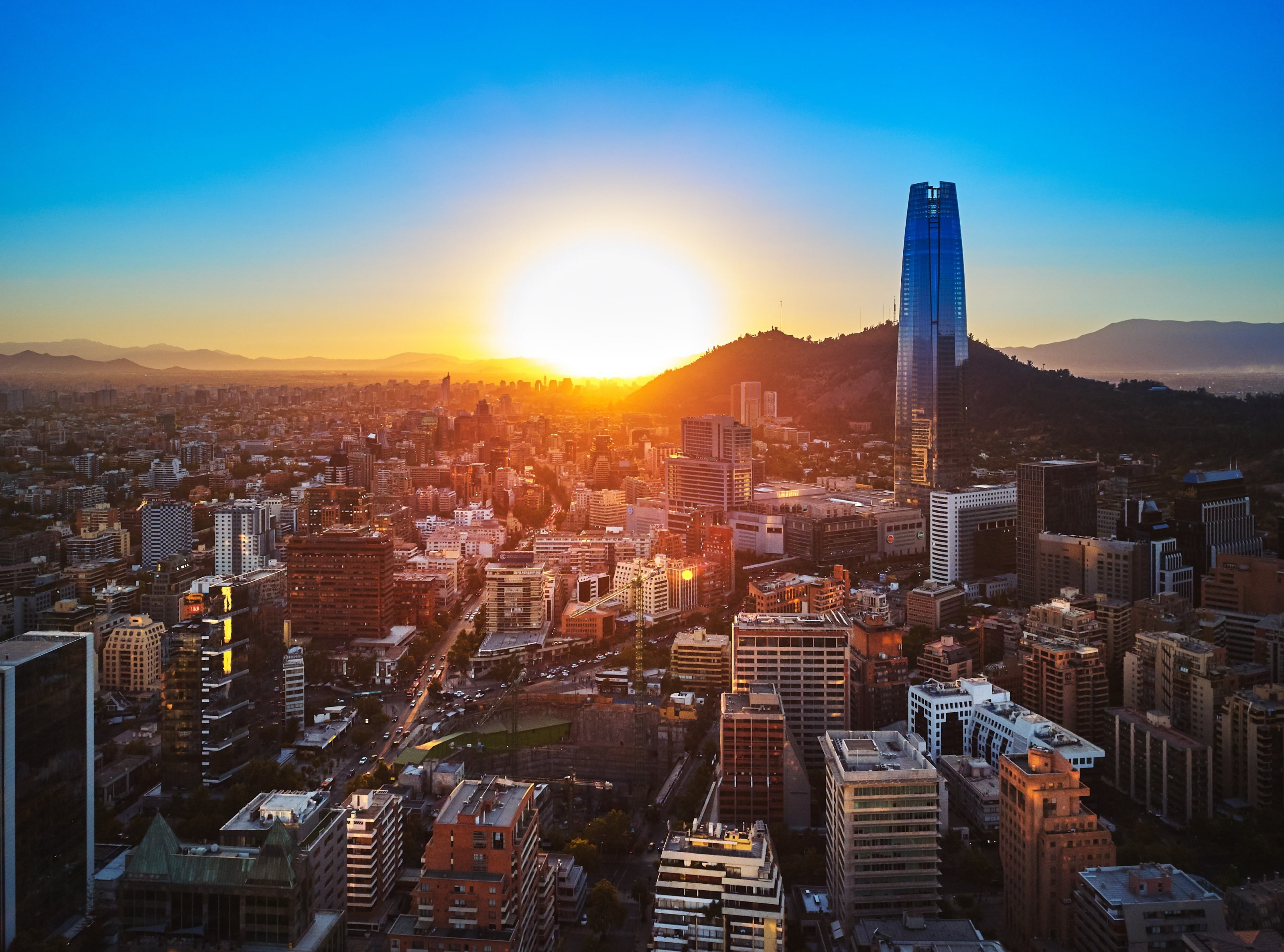 lens flare, architecture, Chile, urban skyline, sunset, building exterior, South America, travel destinations, building, sunlight, no people, skyscraper, HD Wallpaper
