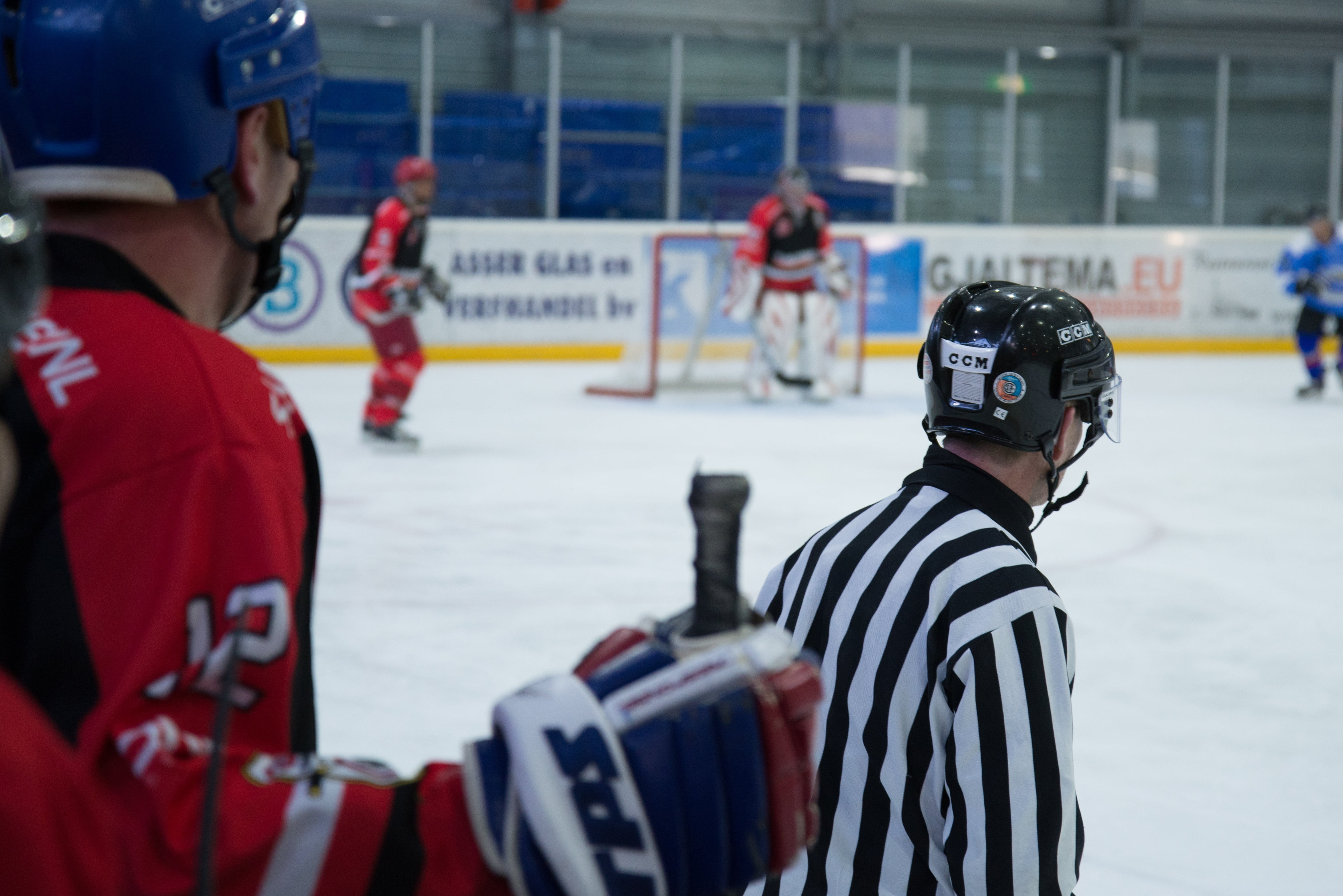 group of people, ice, striped, game, uniform, focus on foreground, equipment, sport, competition, occupation, day, stick, incidental people, security, men, HD Wallpaper