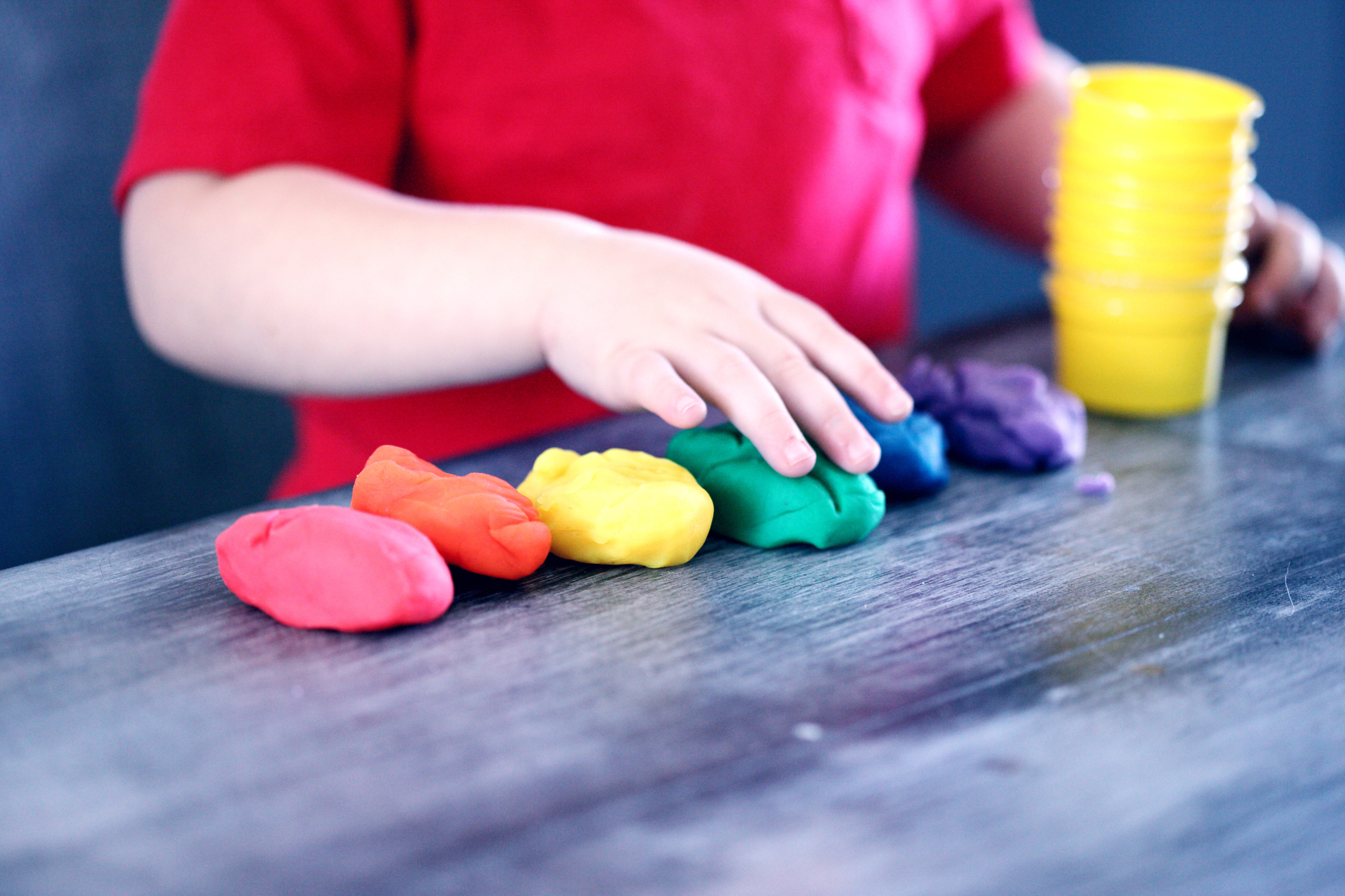selective focus, lesbian, yellow, table, male, playing, hand, egg, red, making, little, shapes, colorful, human body part, child, 5K, vibrant, innocence, HD Wallpaper