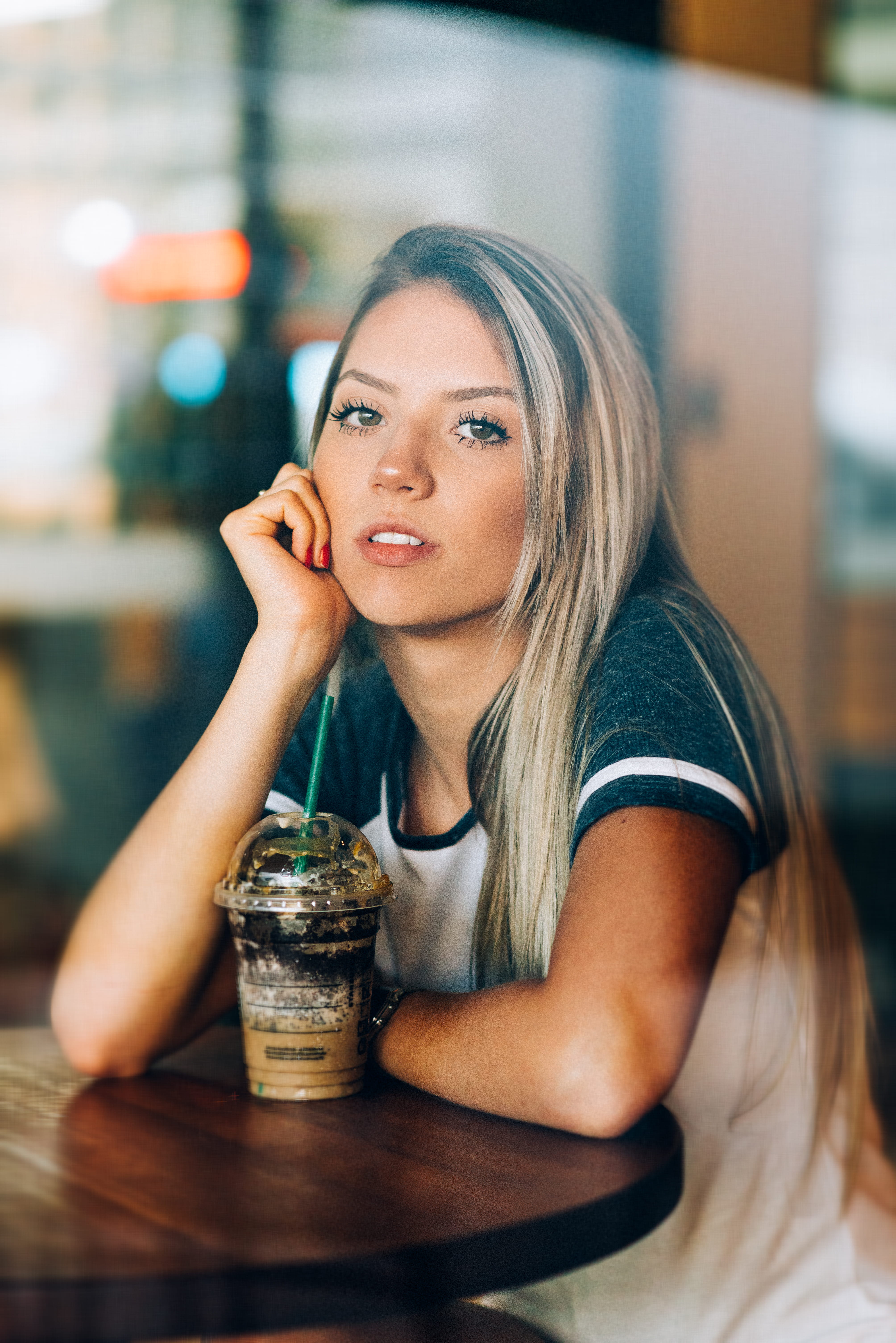 person, table, sitting, facial expression, hair, attractive, hairstyle, drinking, wear, one person, cafe, sit, drink, indoors, looking, t, style, refreshment, Phone HD Wallpaper