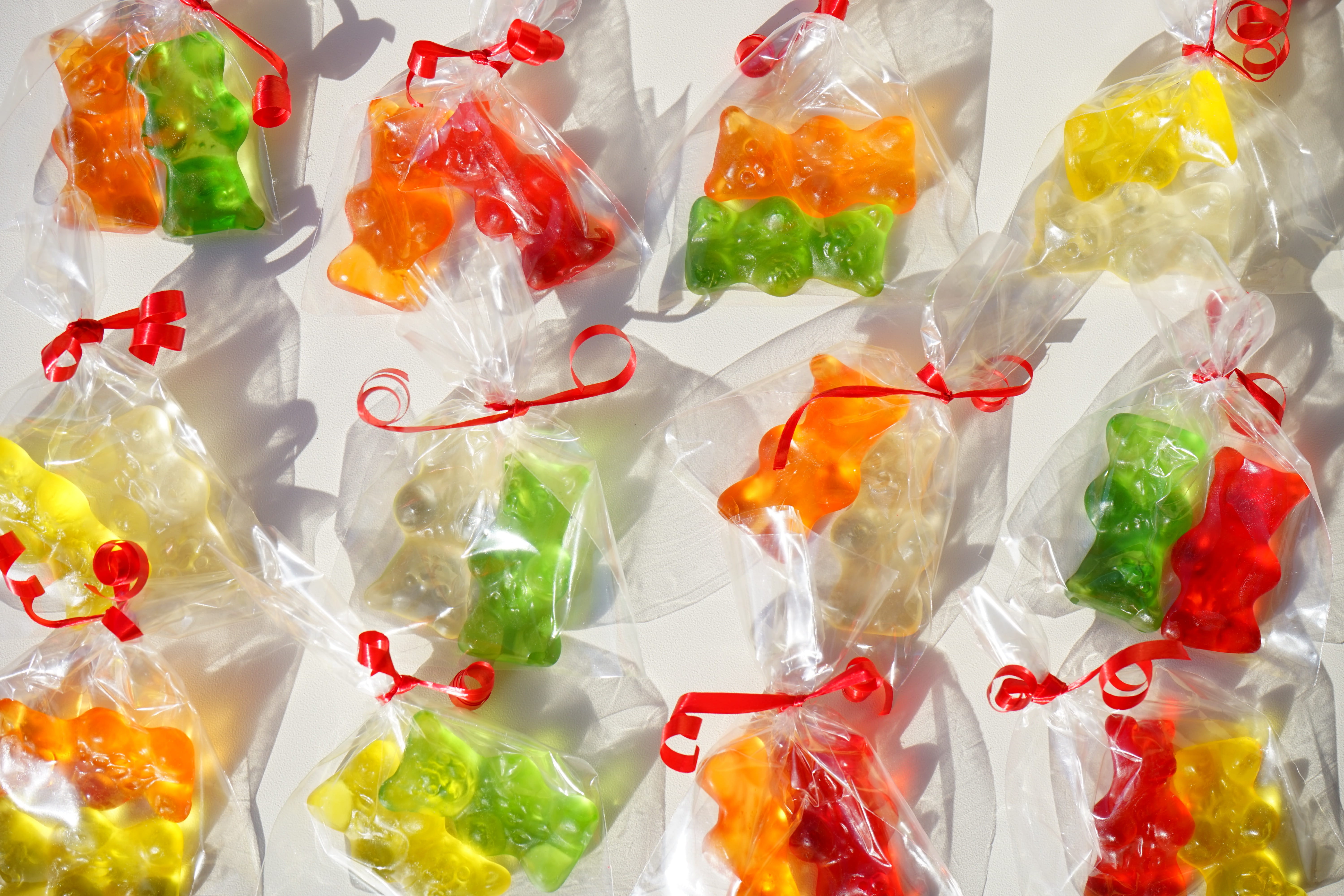 large group of objects, no people, Packed, plastic bag, retail, fruit, sweetness, bear, Haribo, plastic, bag, sachets, bears, gelatin, full frame, food and drink, HD Wallpaper